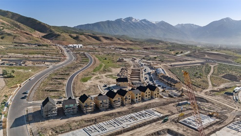 Aerial view looking towards mountains with the new homes.