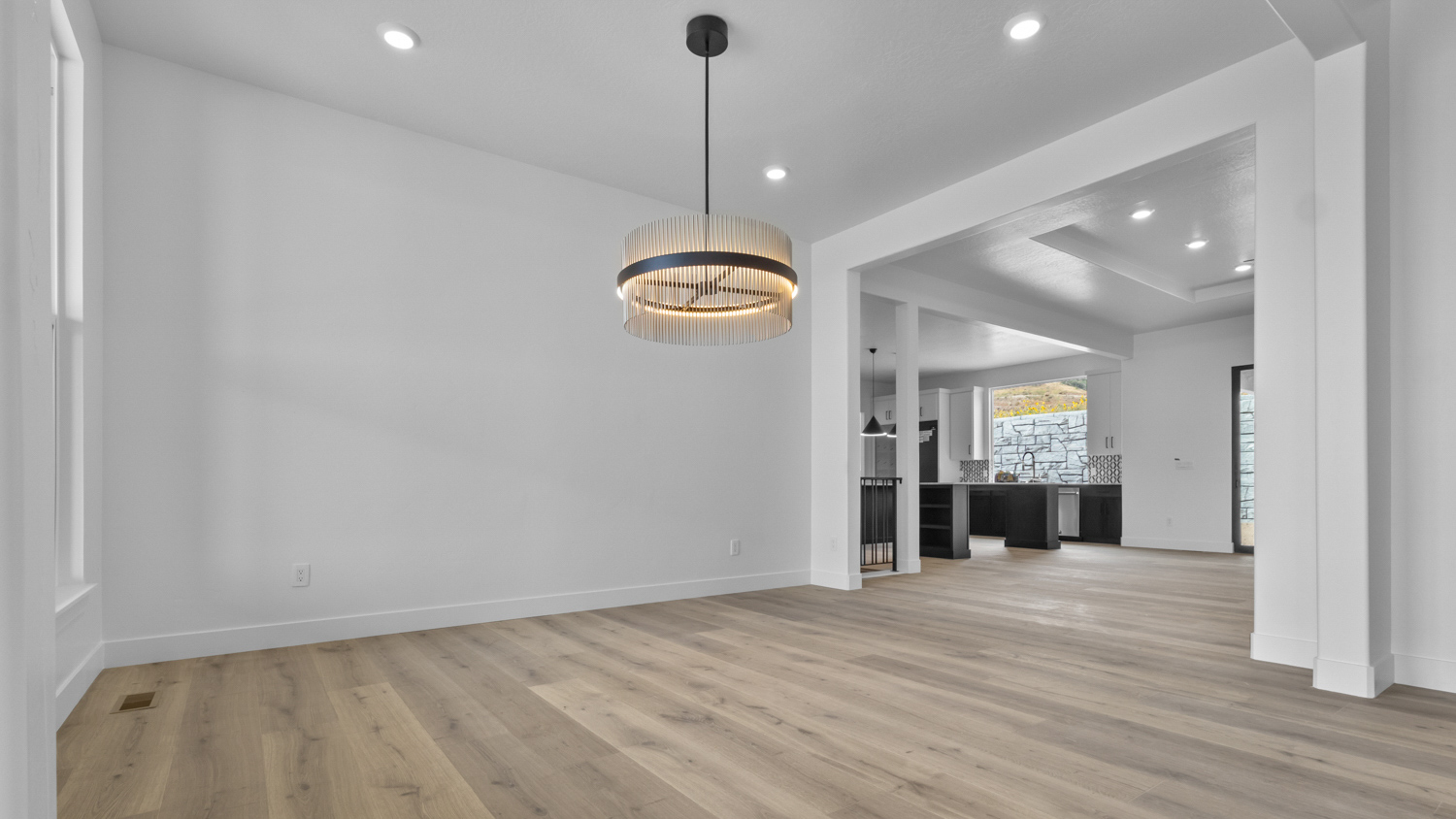 Front dining room with large window.
