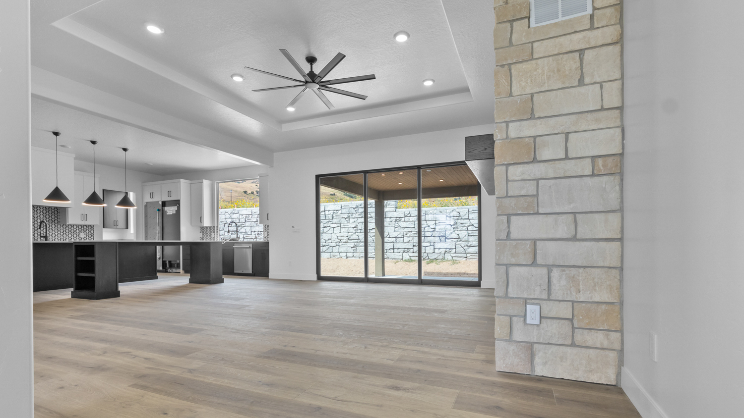 Family room with sliding glass doors and fireplace.