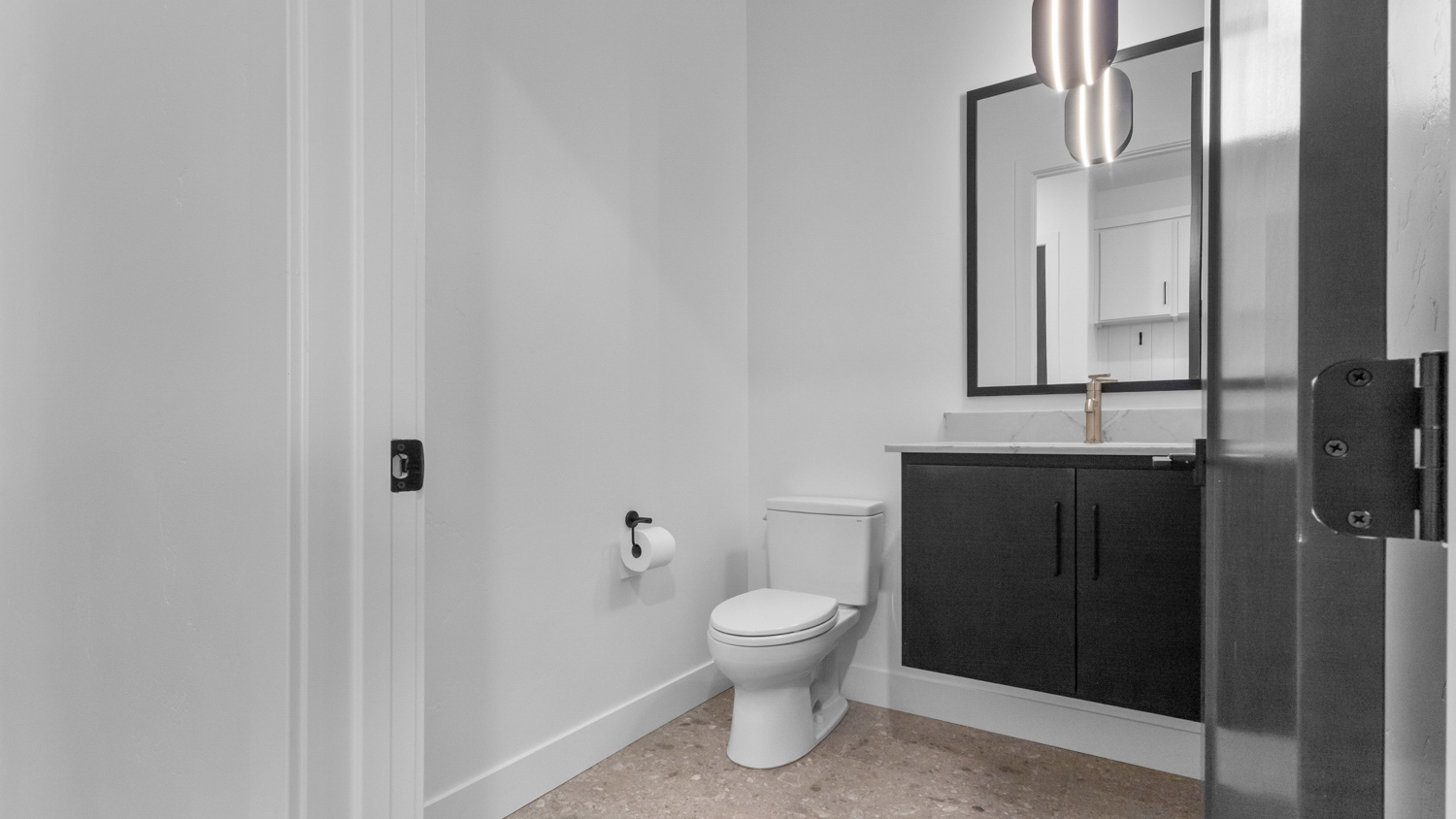 Powder bathroom with floating sink vanity.