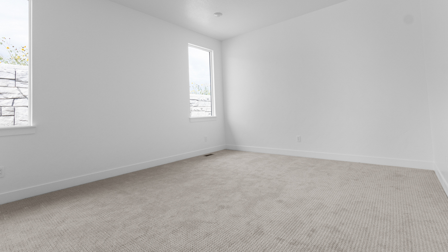 Primary bedroom with windows.