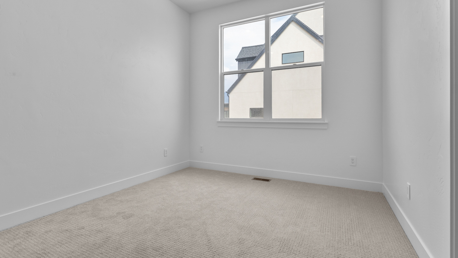 Bedroom with large window.