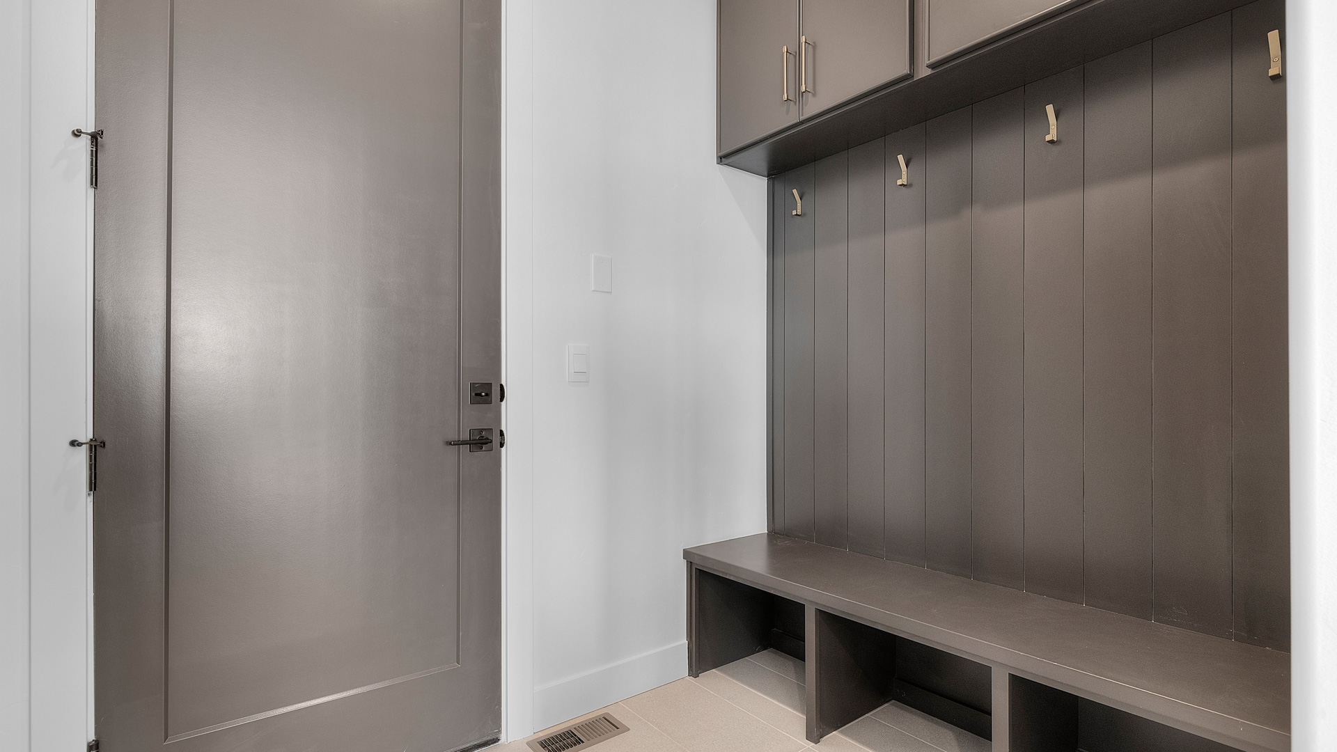 Mudroom with storage off garage.