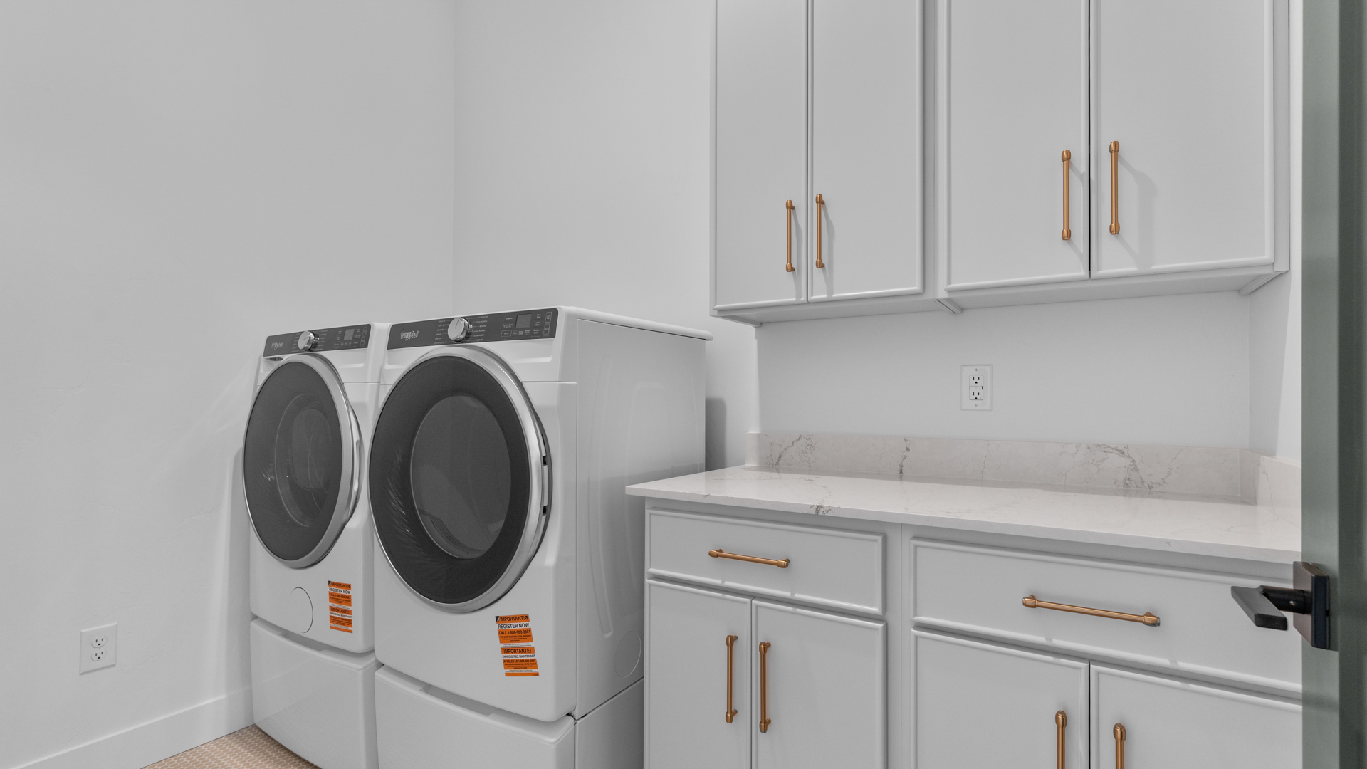 Laundry room with cabinet storage.