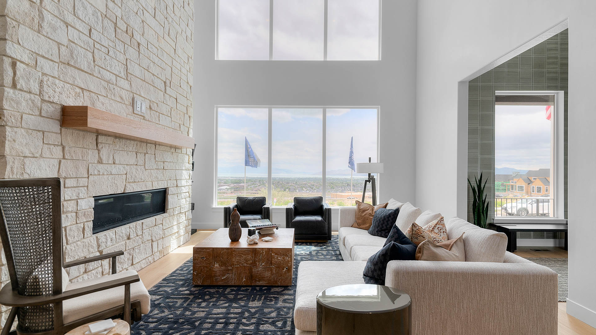 Family room with two story windows and fireplace.