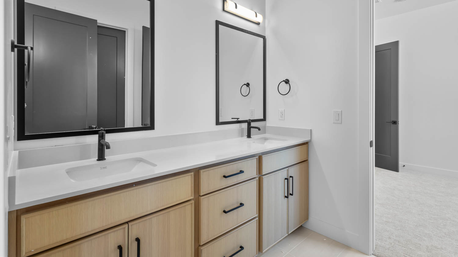 Double sink vanity in jack and jill bathroom.