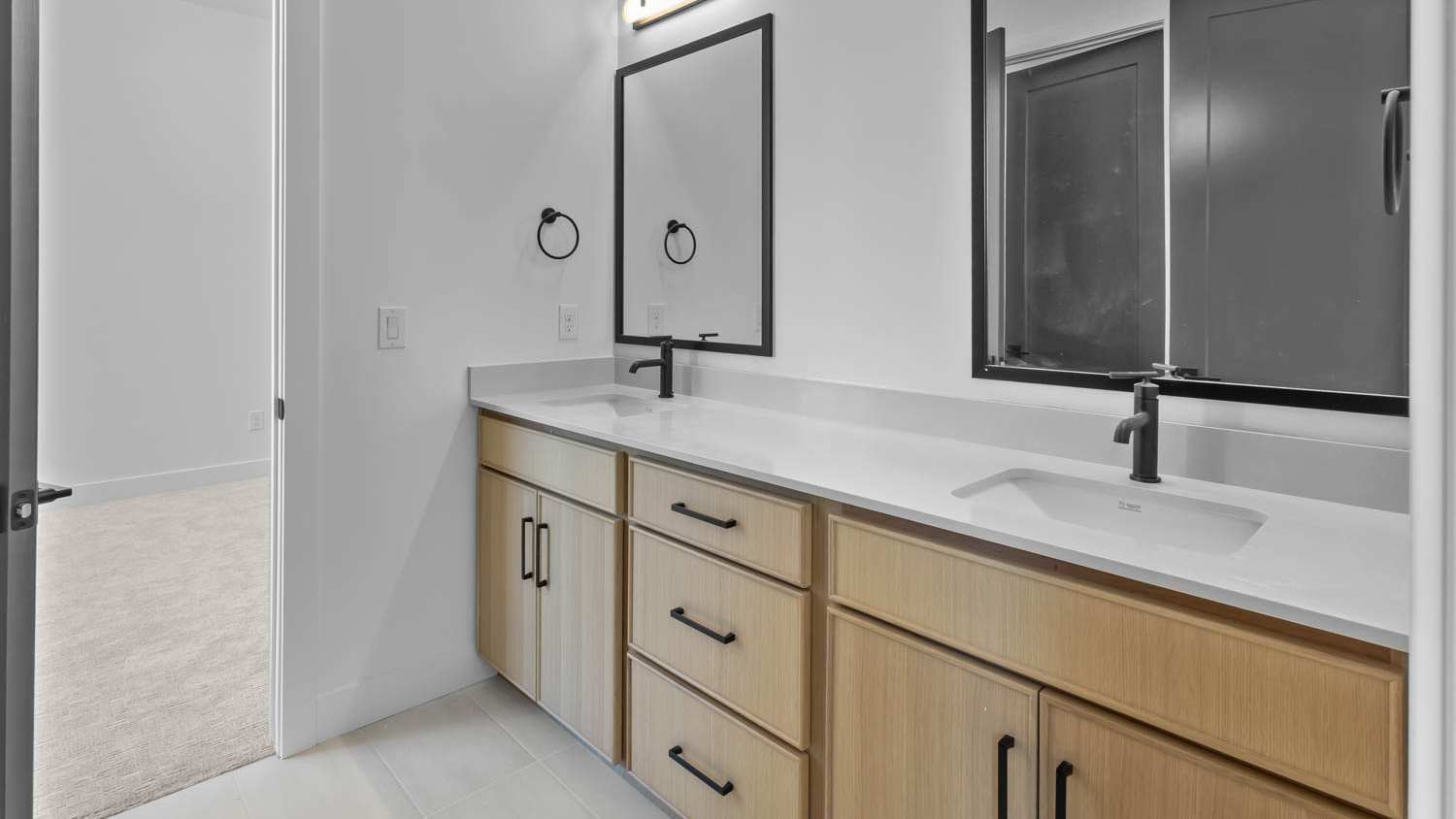 Double sink vanity in jack and jill bathroom.
