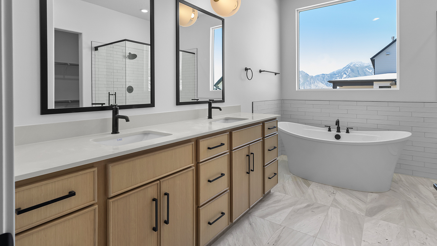 Primary bathroom with double sink vanity.