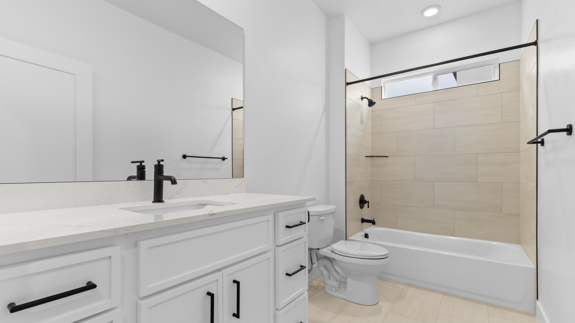 Bathroom with window above shower.