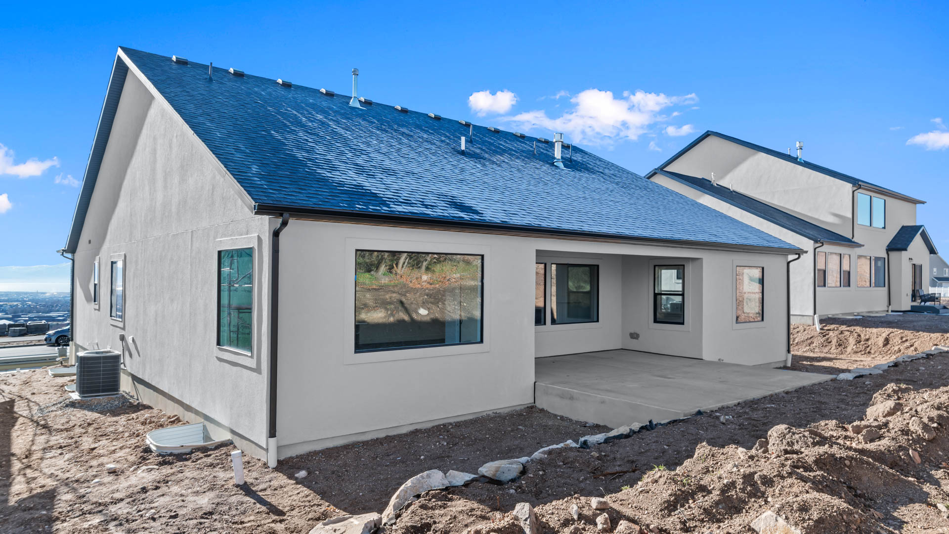 Back of home featuring covered patio.