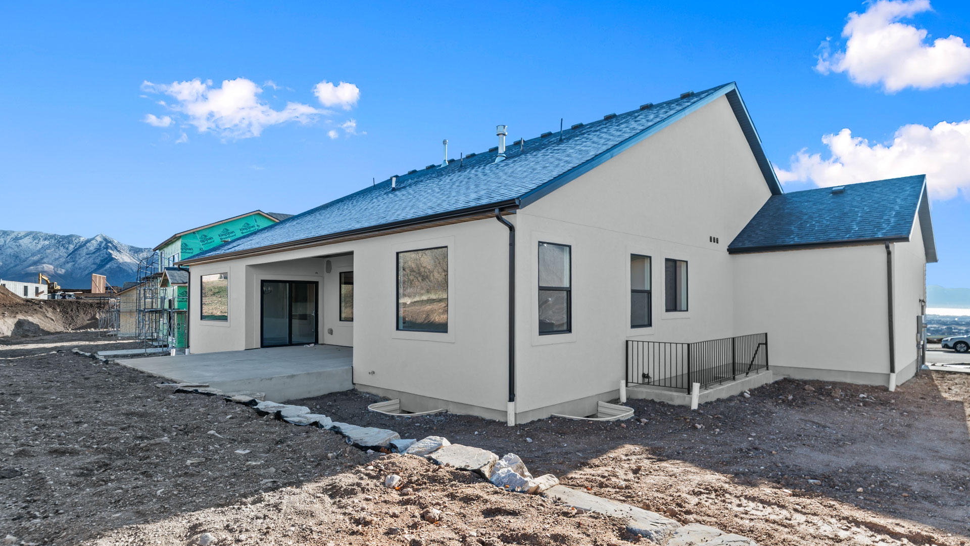 Back of home featuring covered patio.