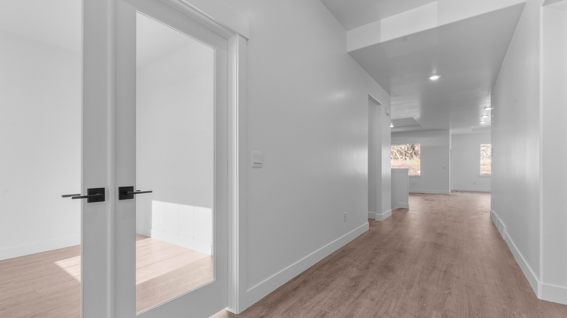 Spacious entryway into main living and office.