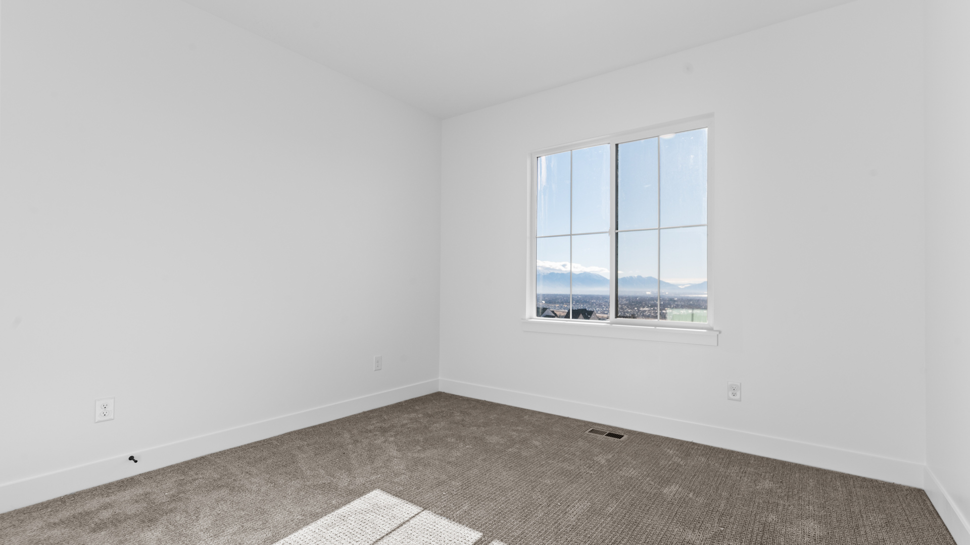 Bedroom with large window.