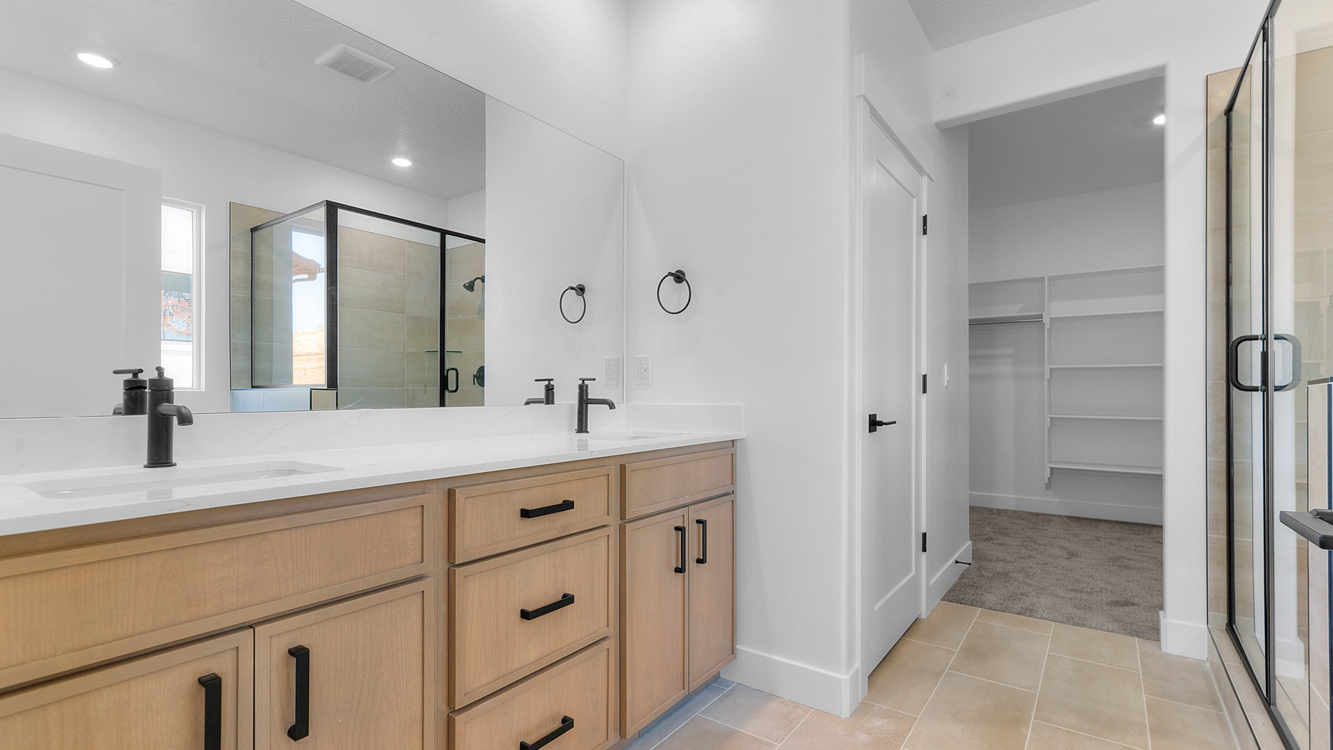 Primary bathroom with double sink vanity.