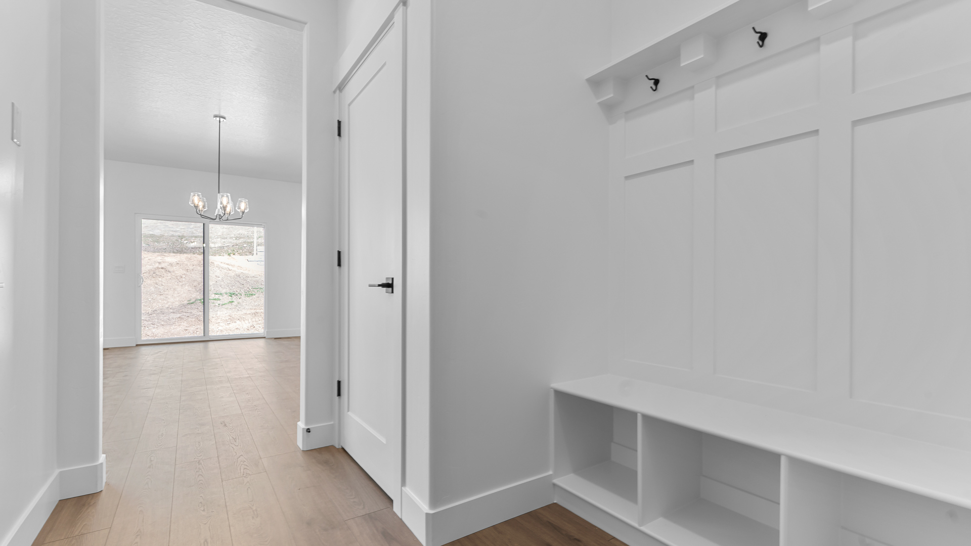 Mudroom with coat closet and bench.