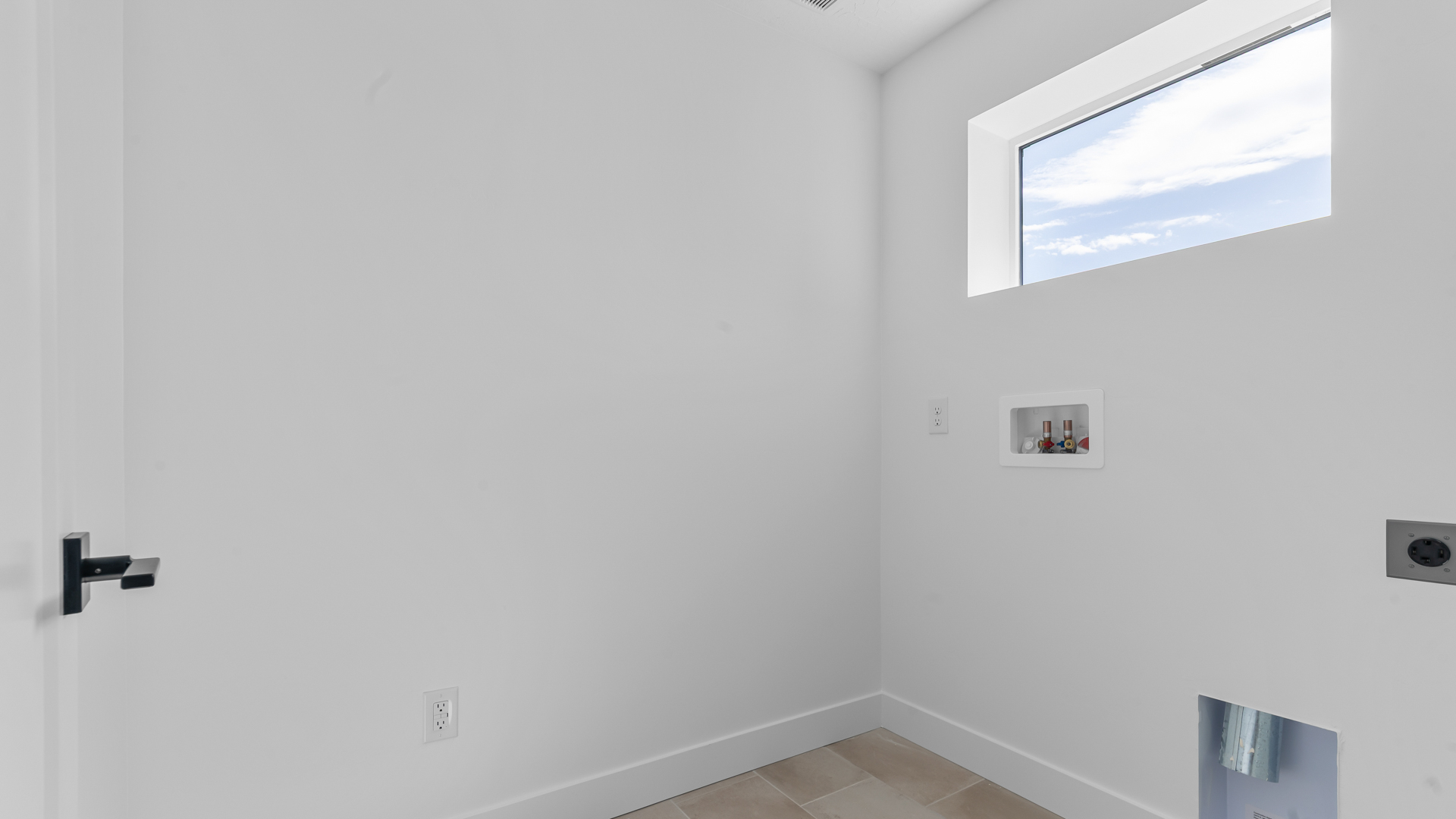 Laundry room with window.