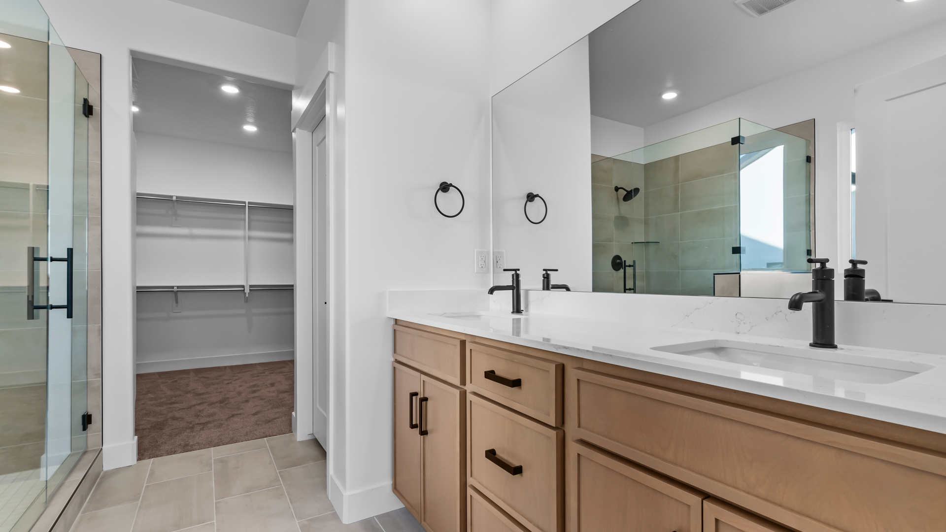 Primary bathroom with double sink vanity.