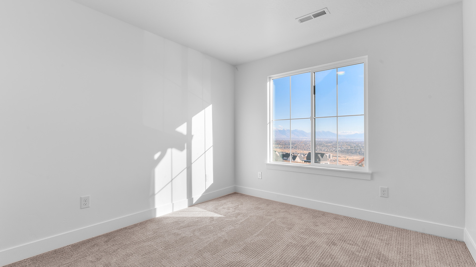 Bedroom 1 with large window.