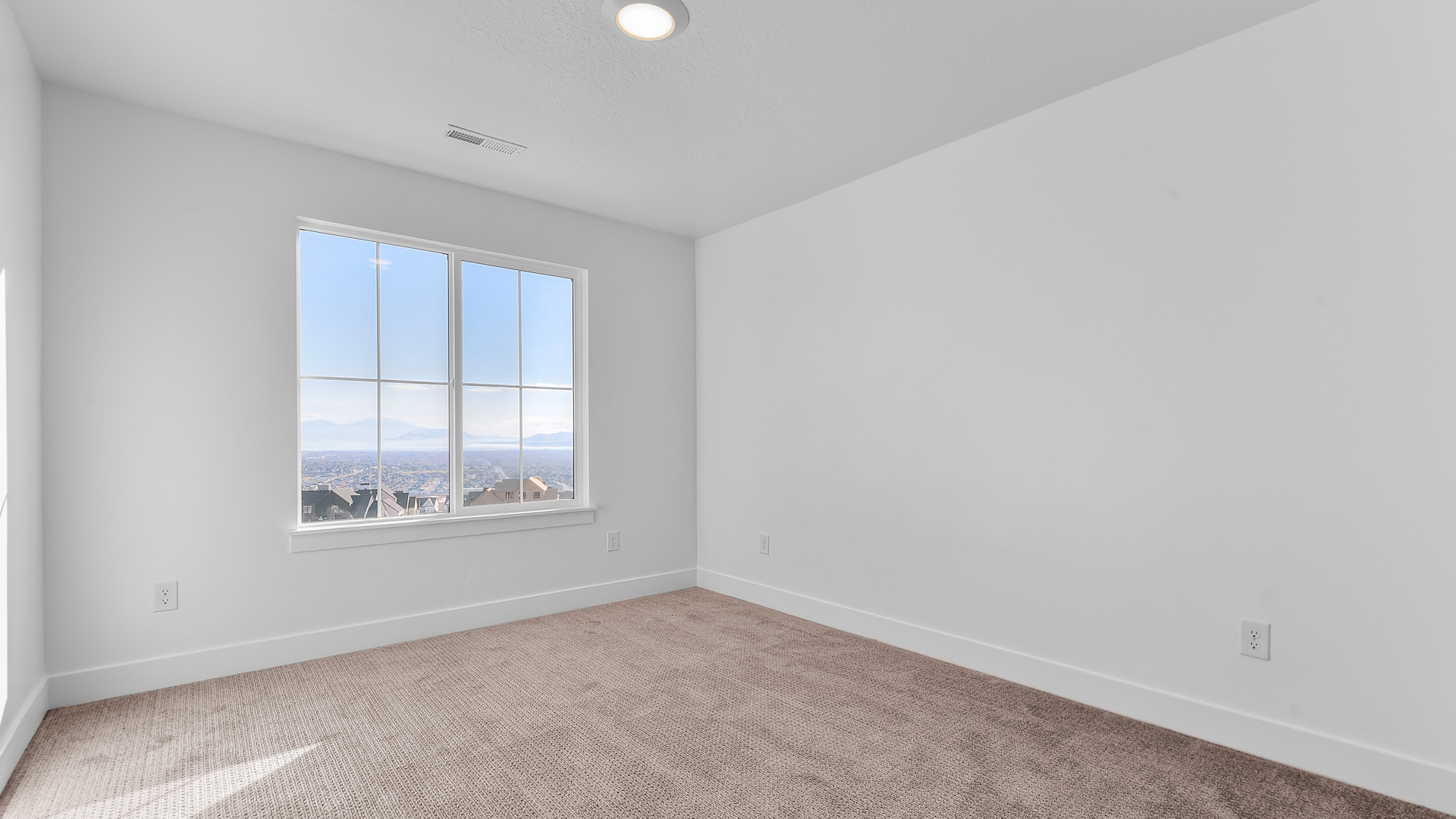 Bedroom 2 with large window.
