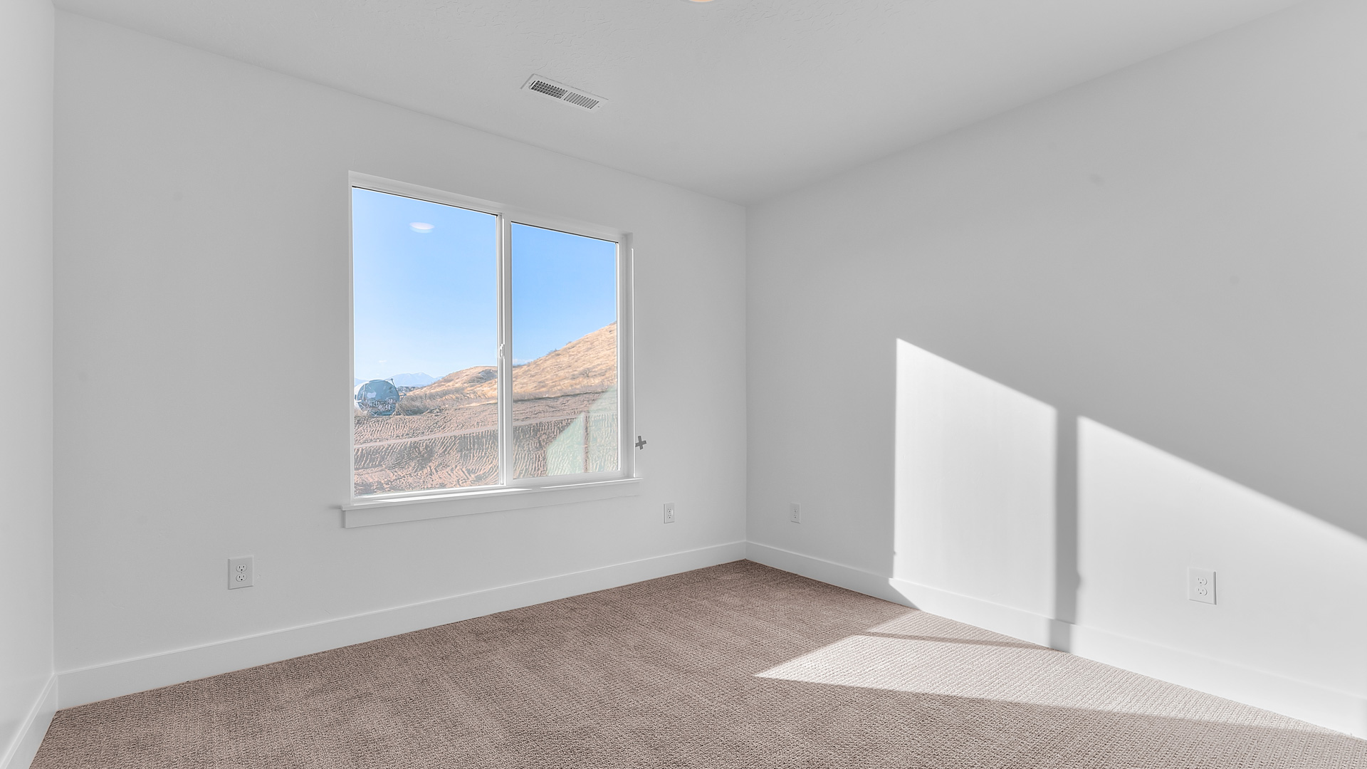 Bedroom 3 with large window.