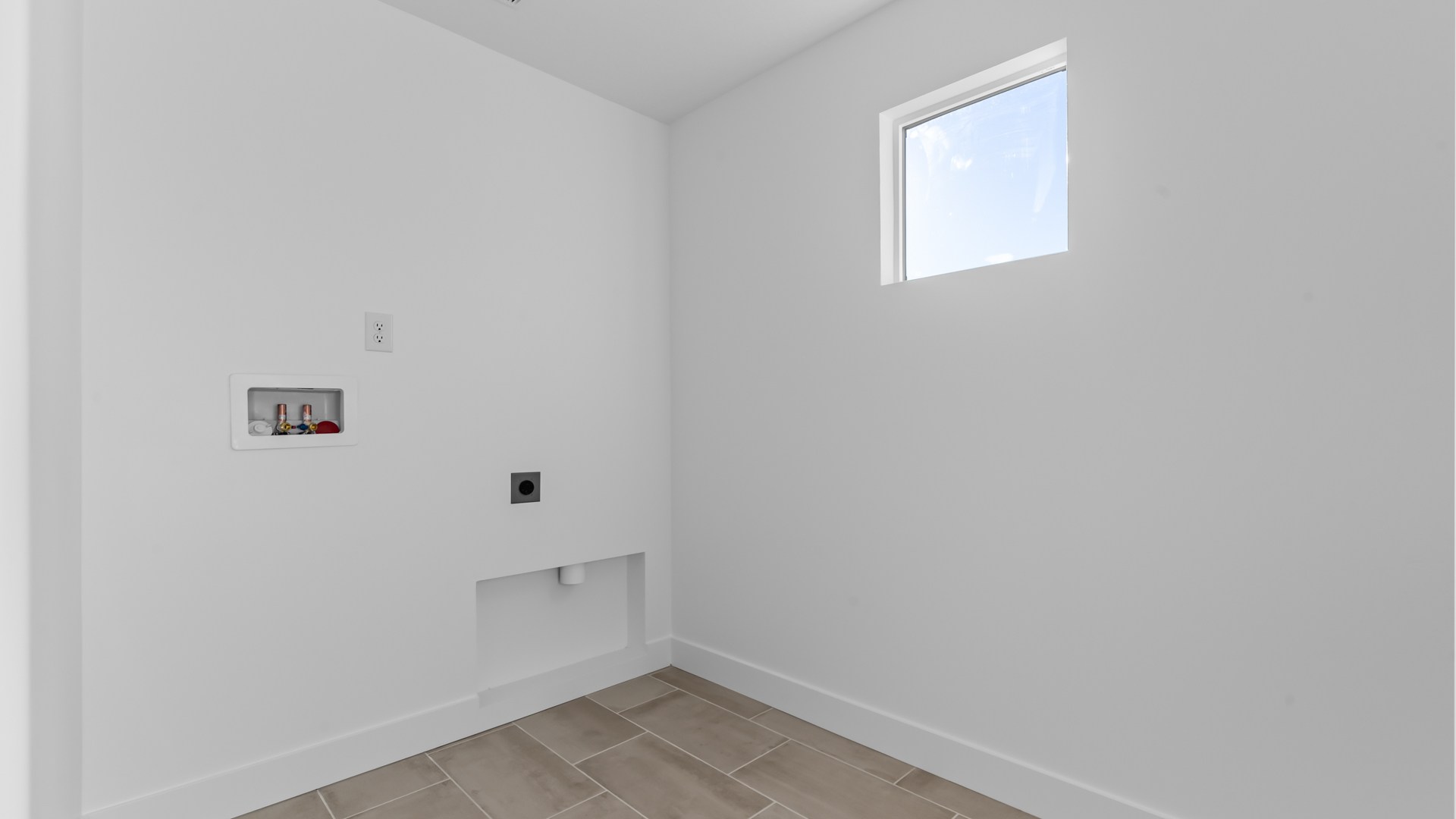 Laundry room with window.