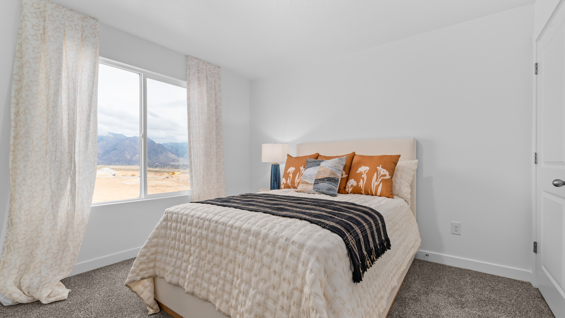 Bedroom with large window.