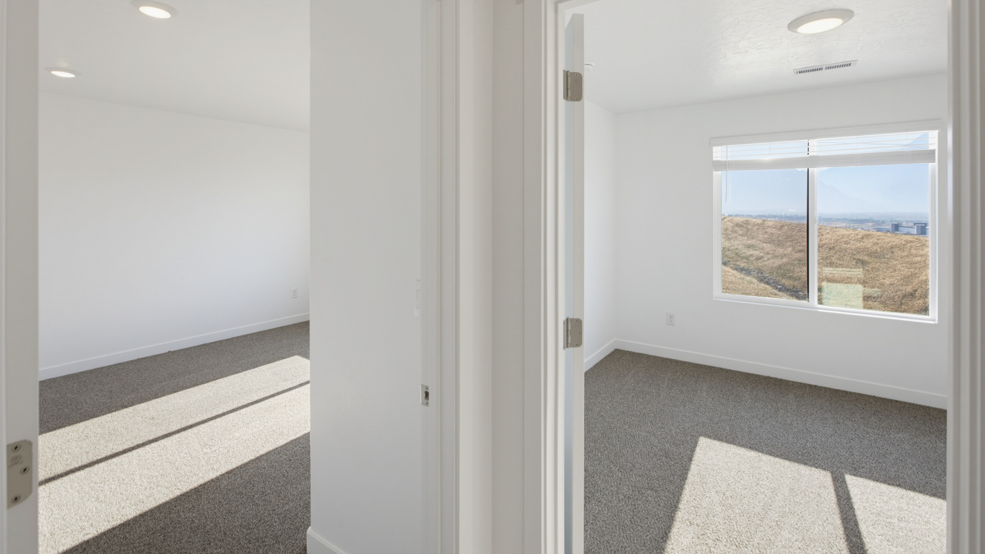 Primary bedroom with large windows