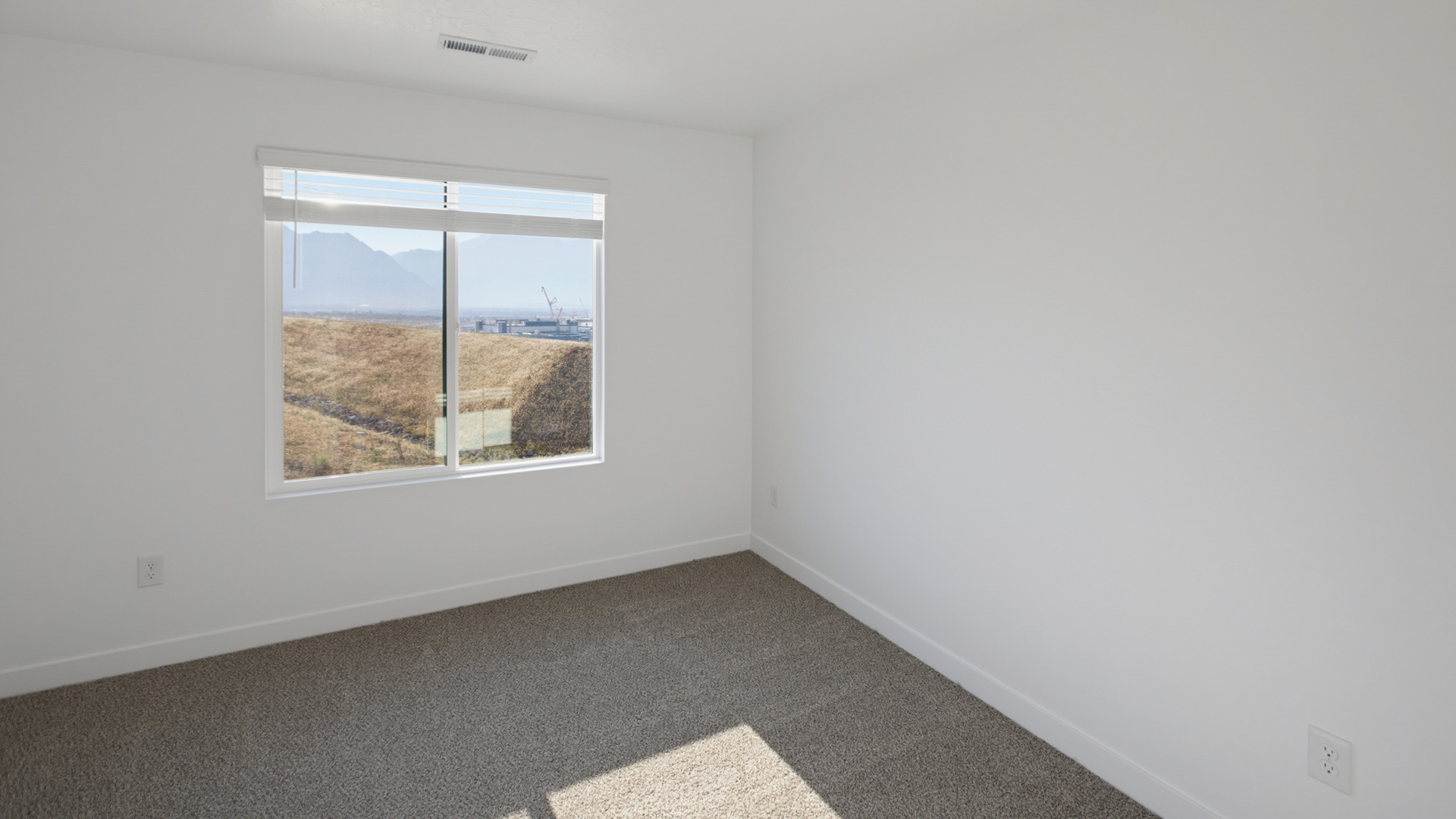 Primary bedroom with large windows