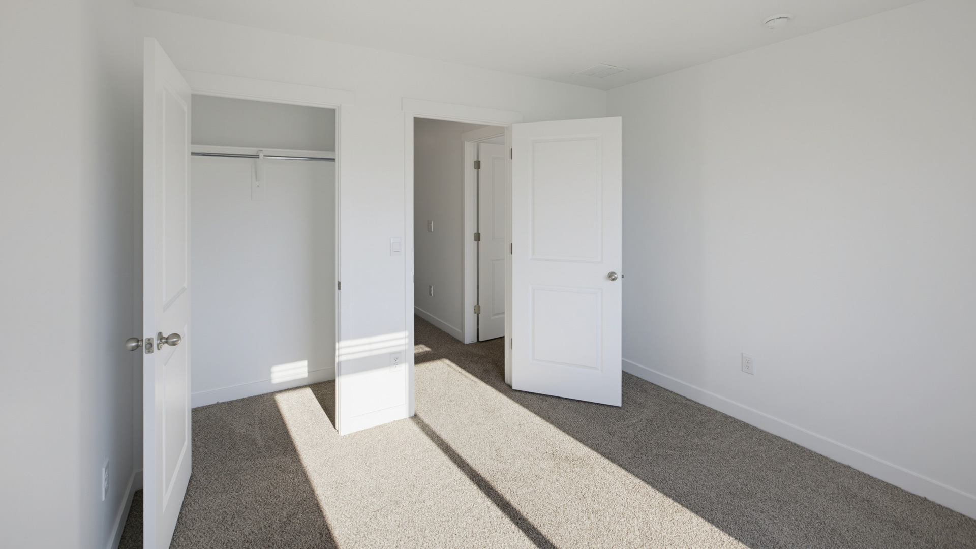 Primary bedroom with large windows