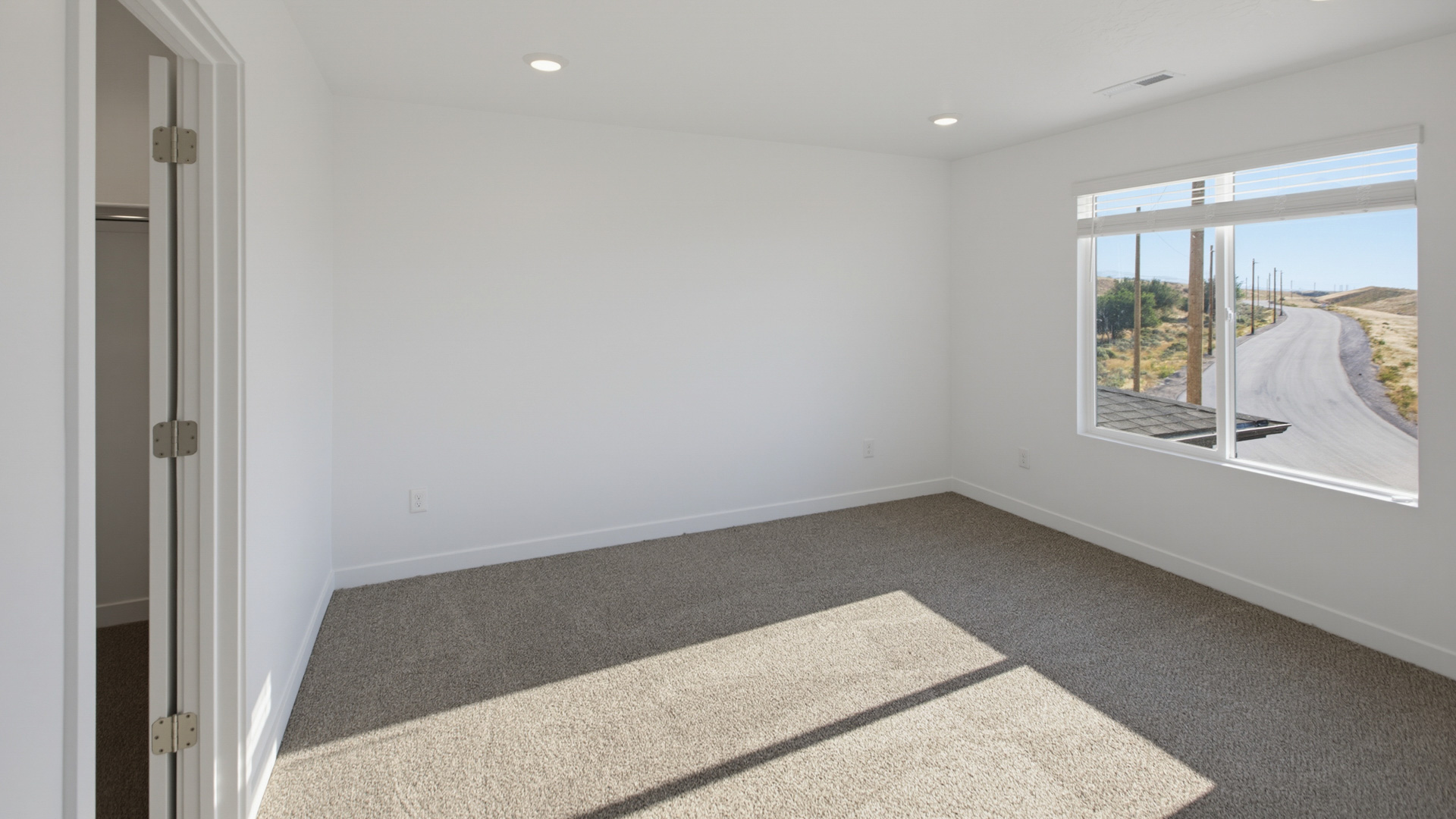 Primary bedroom with large windows