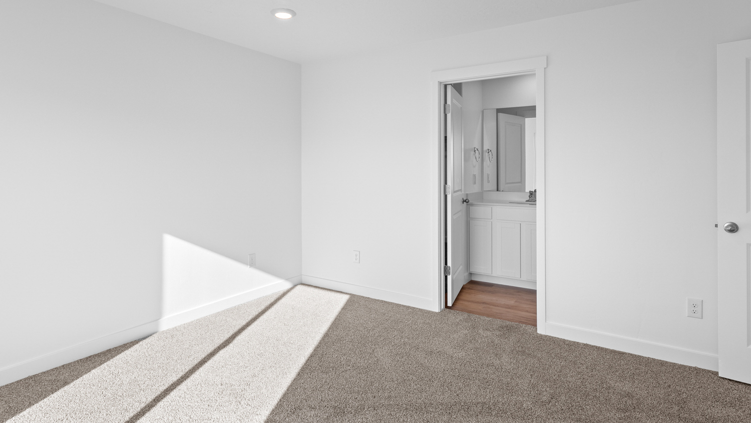 Primary bedroom with large window.