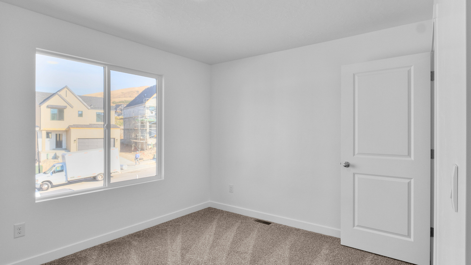 Bedroom with large window.