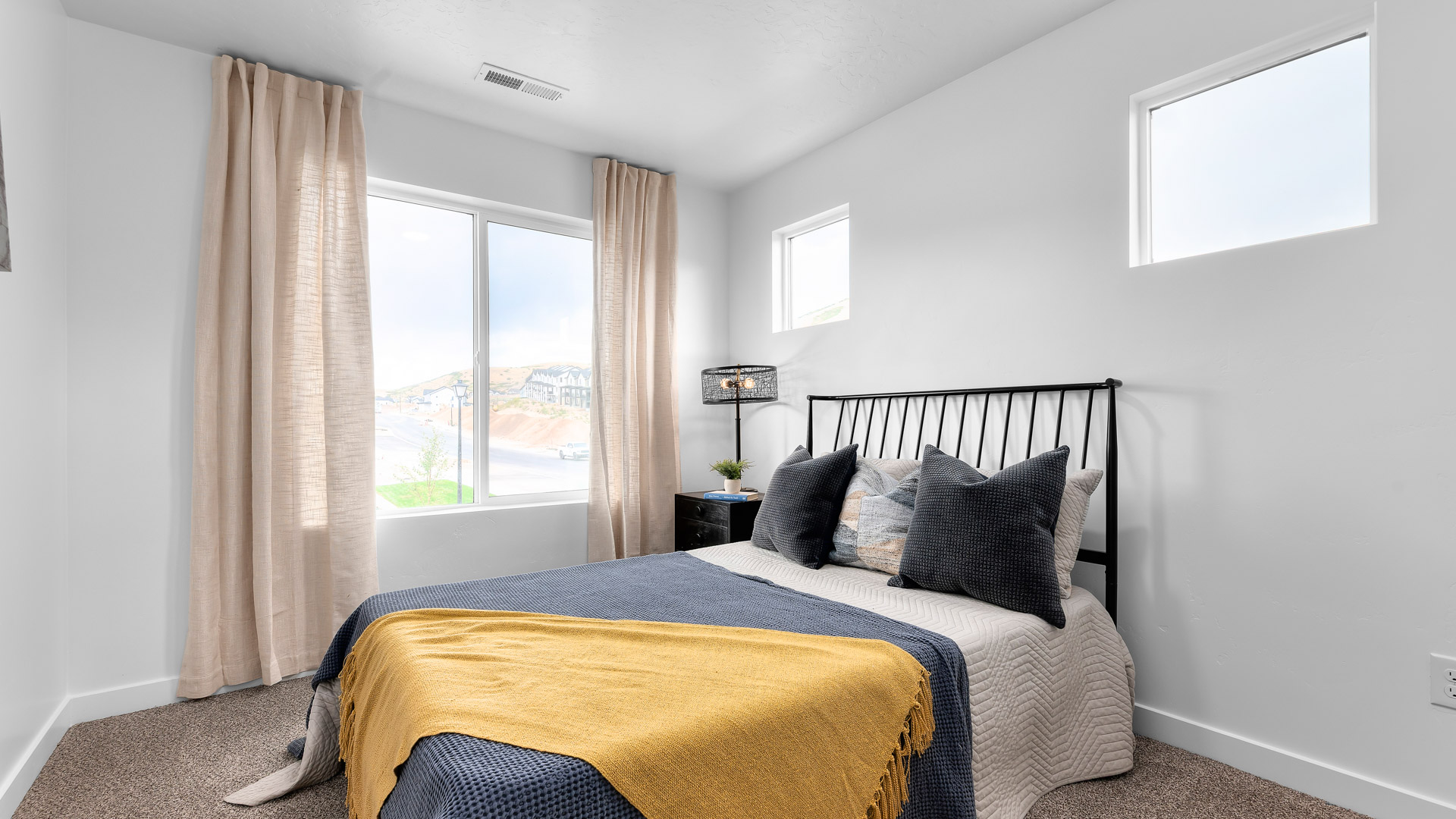 Bedroom with large window.