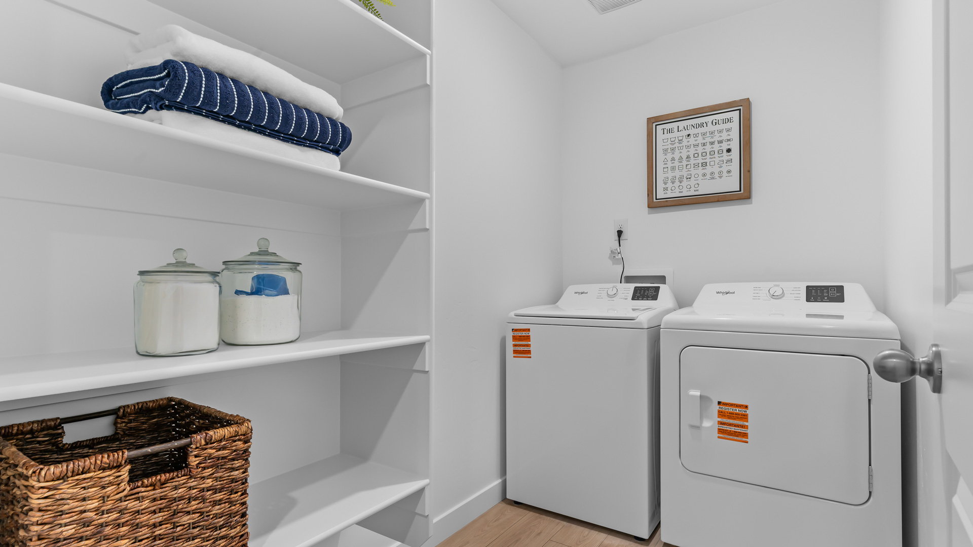 Laundry room with storage shelving.