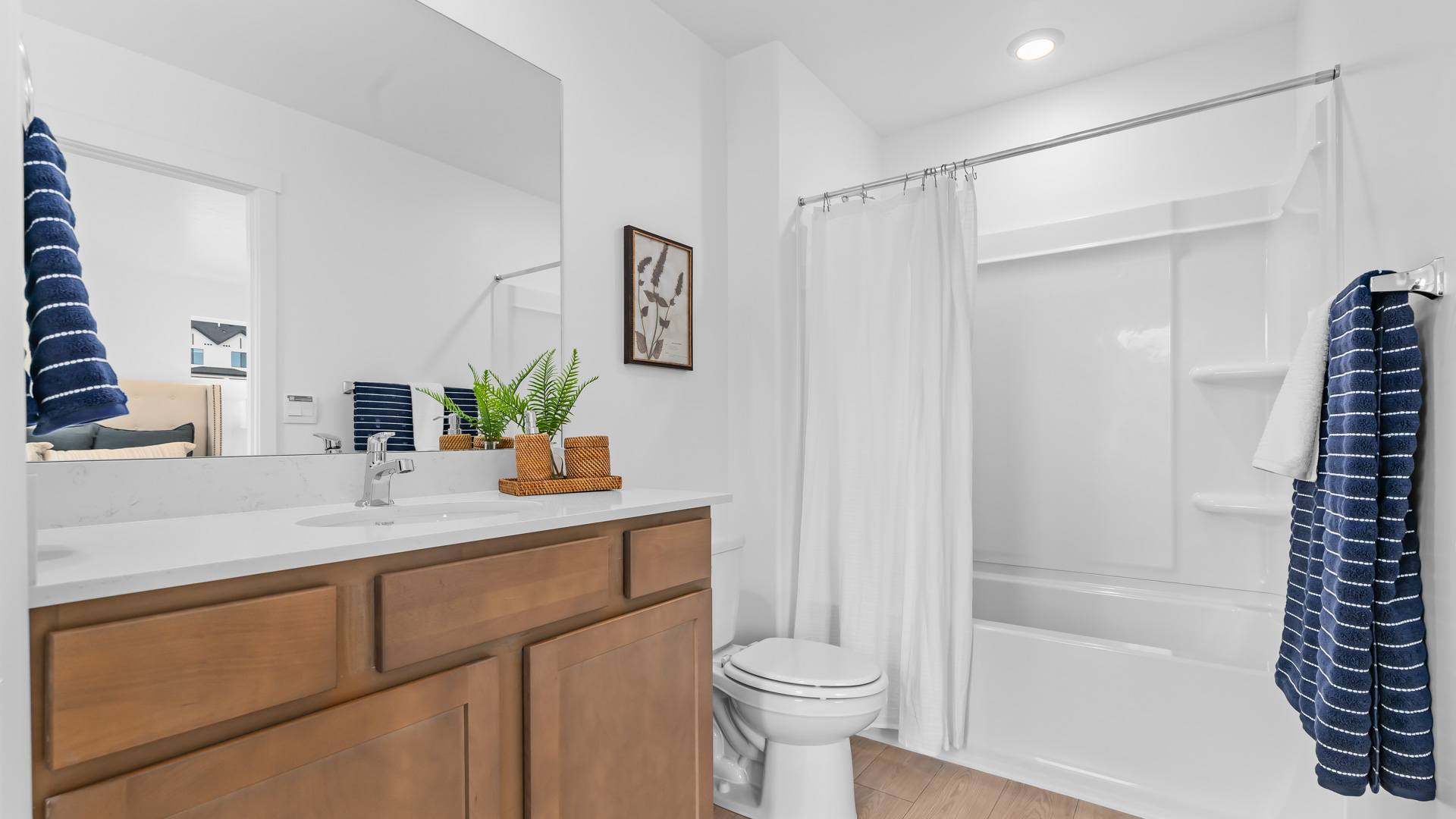 Primary bathroom with shower surround.