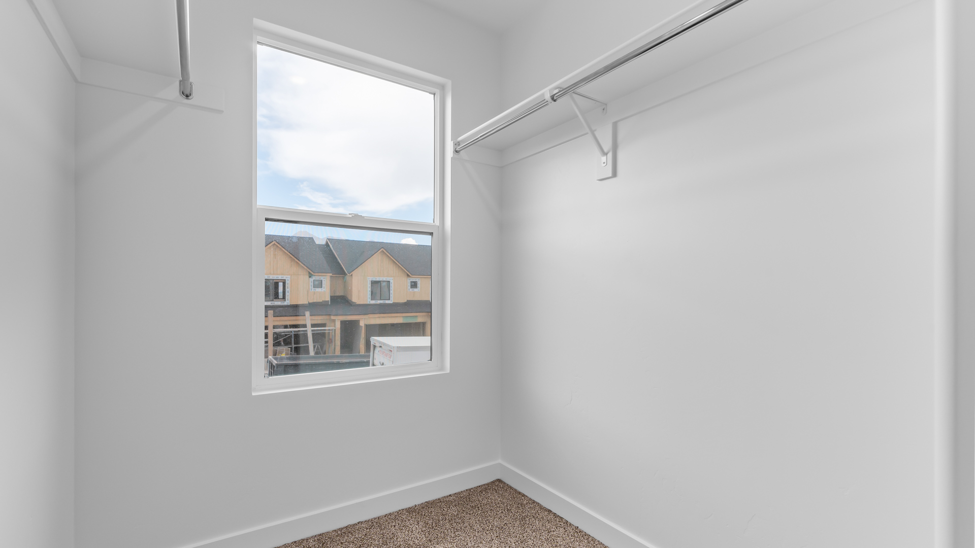 Walk-in closet with window.