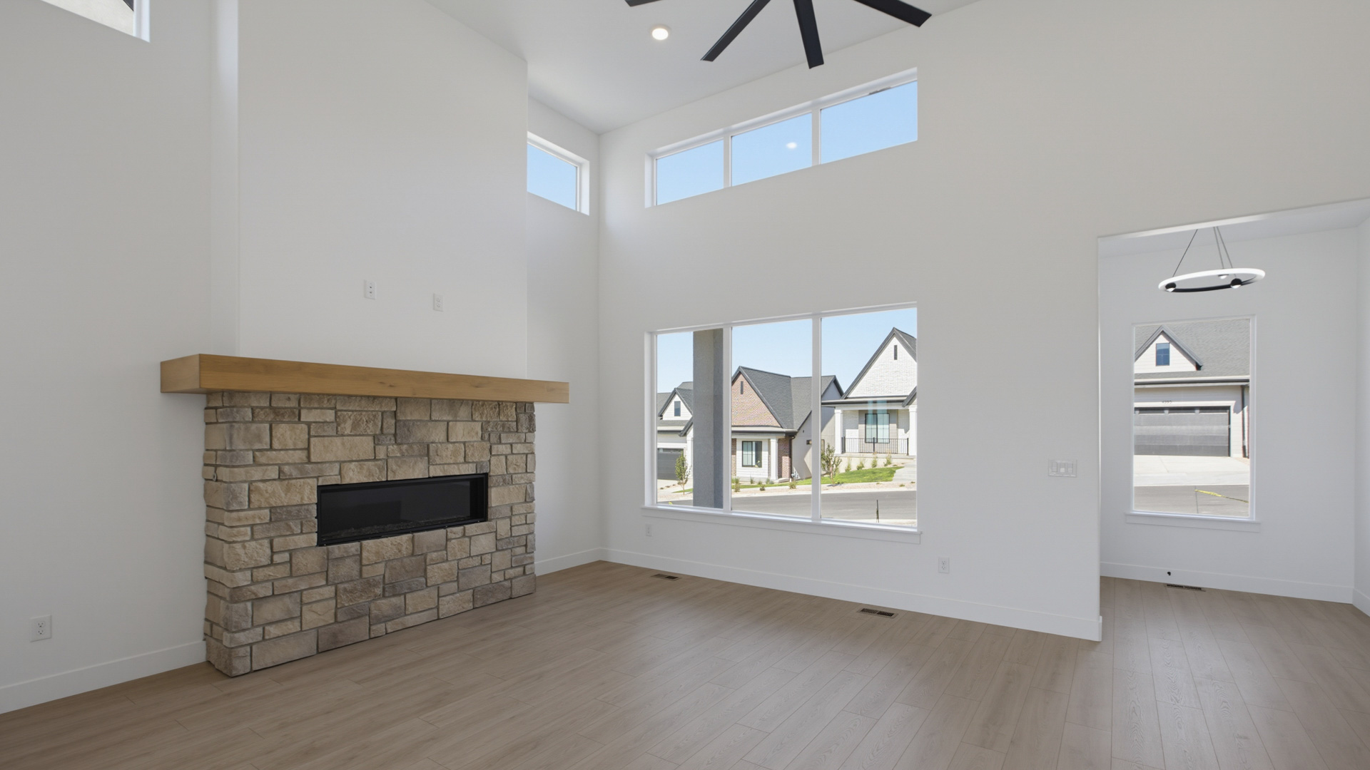 Family room with tall ceiling and fireplace.