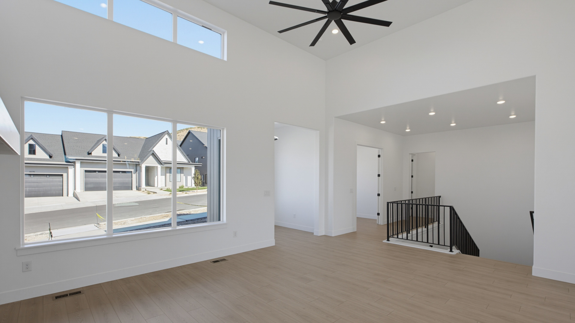 Family room with tall ceiling and fireplace.