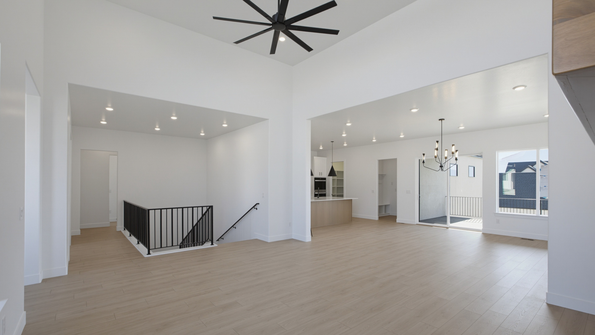 Family room with tall ceiling and fireplace.
