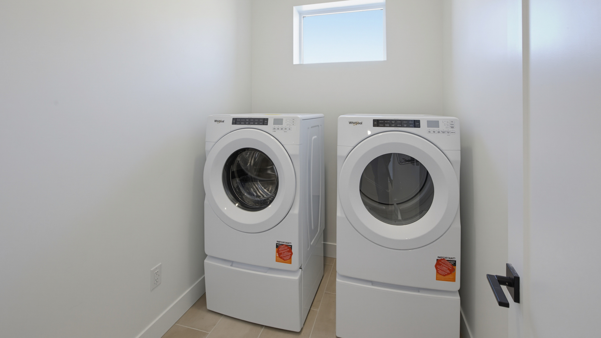 Laundry room with window.