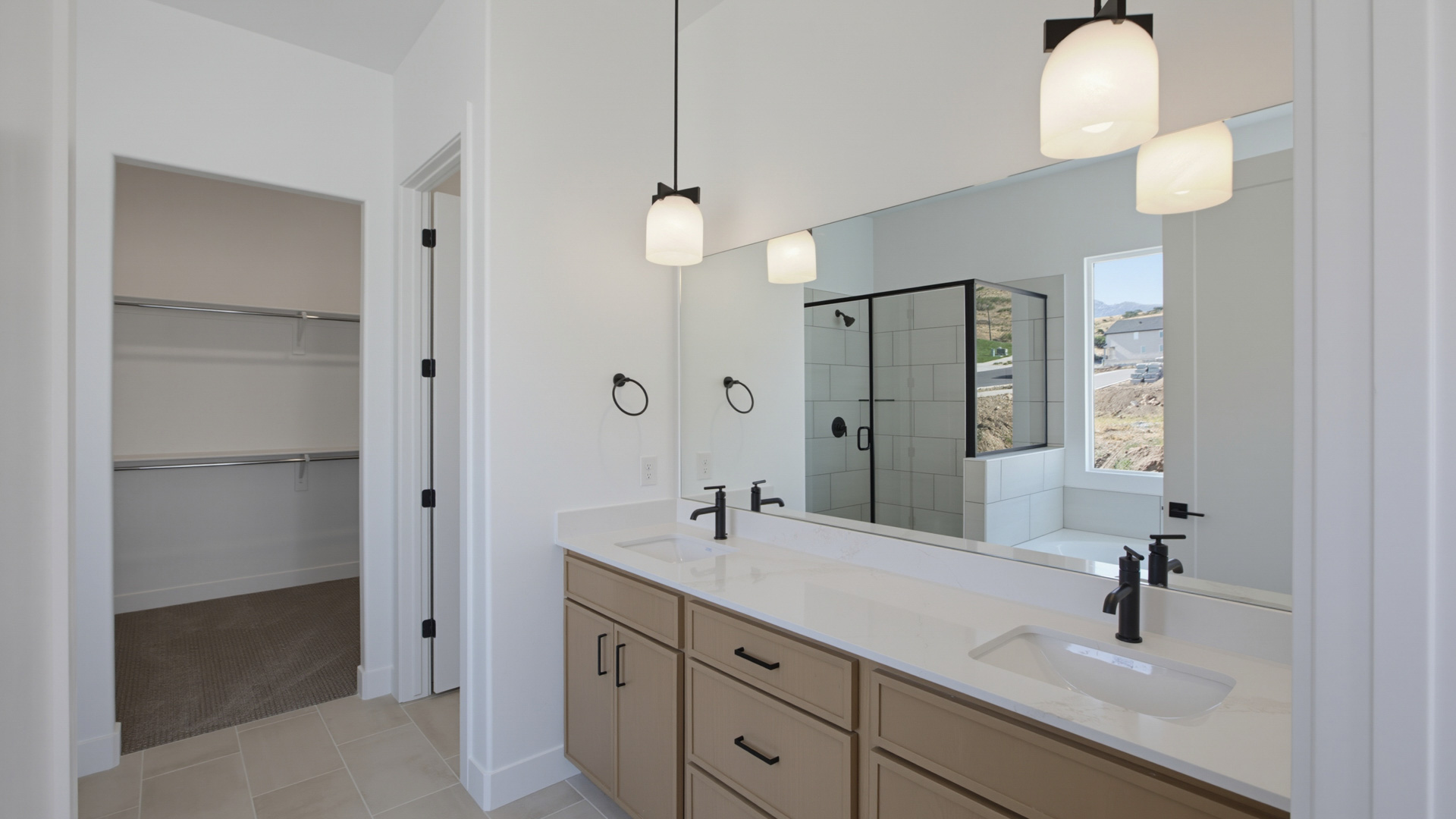 Primary bathroom with double sink vanity.