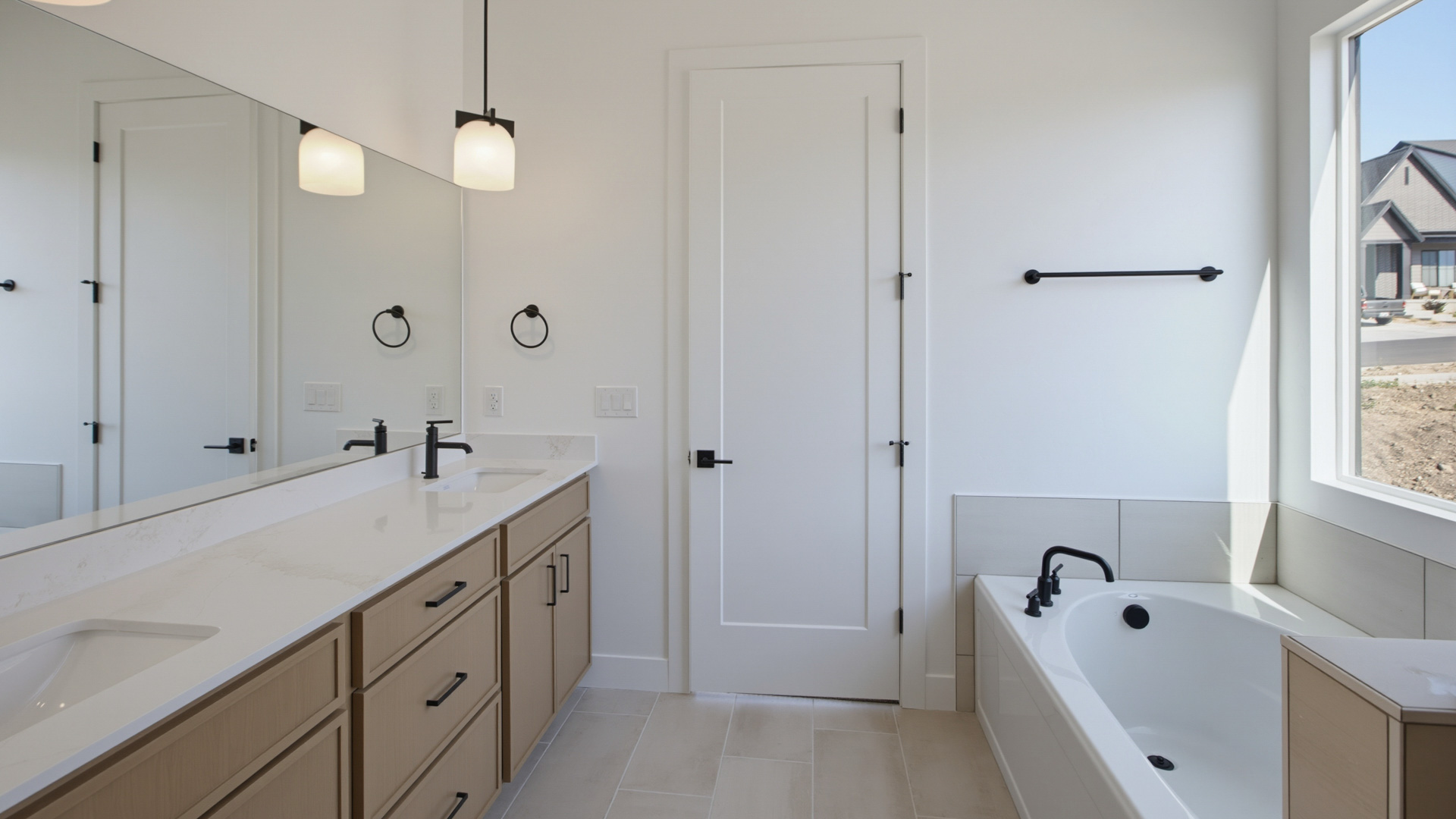 Primary bathroom with double sink vanity.