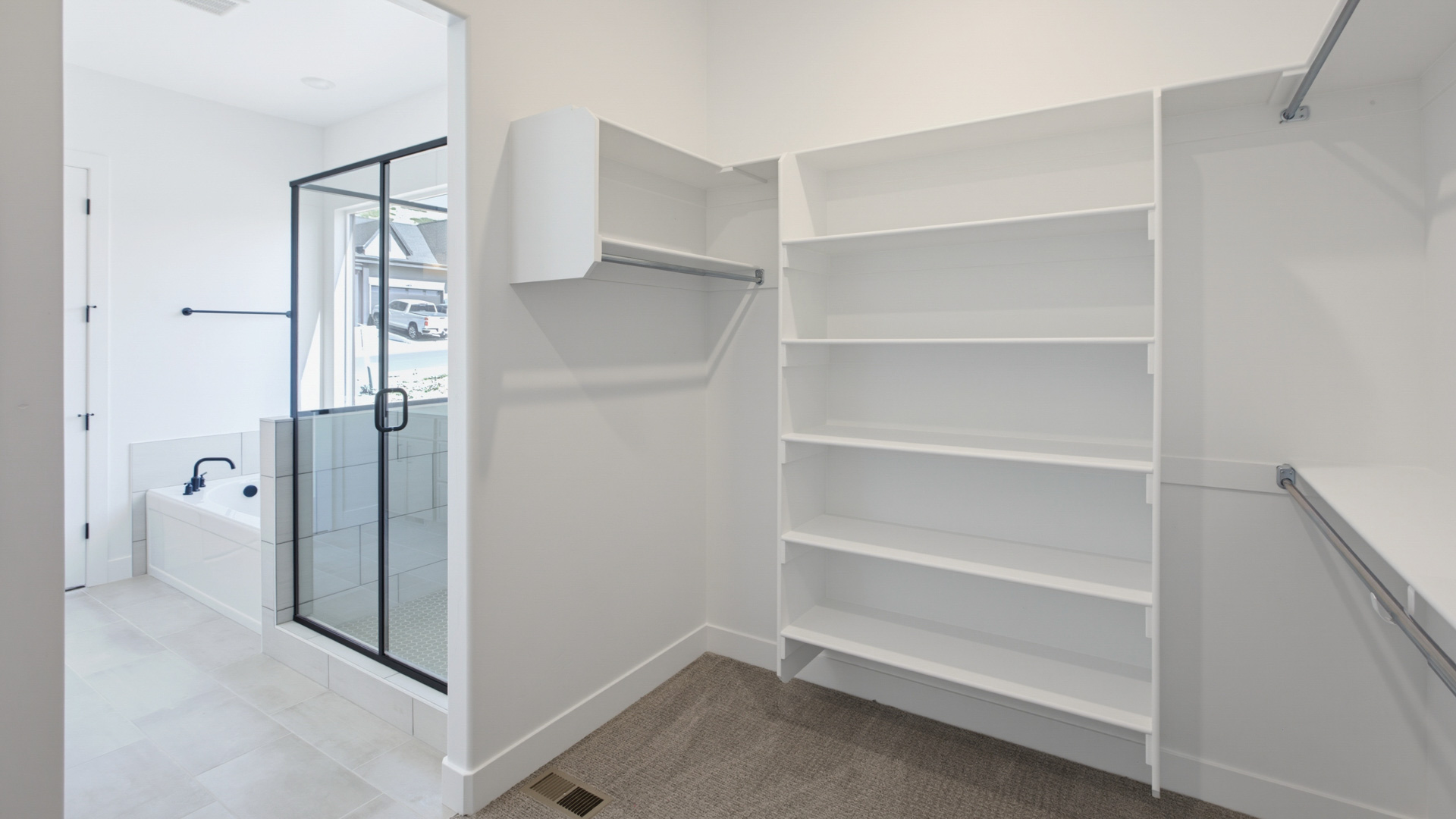 Primary walk-in closet.