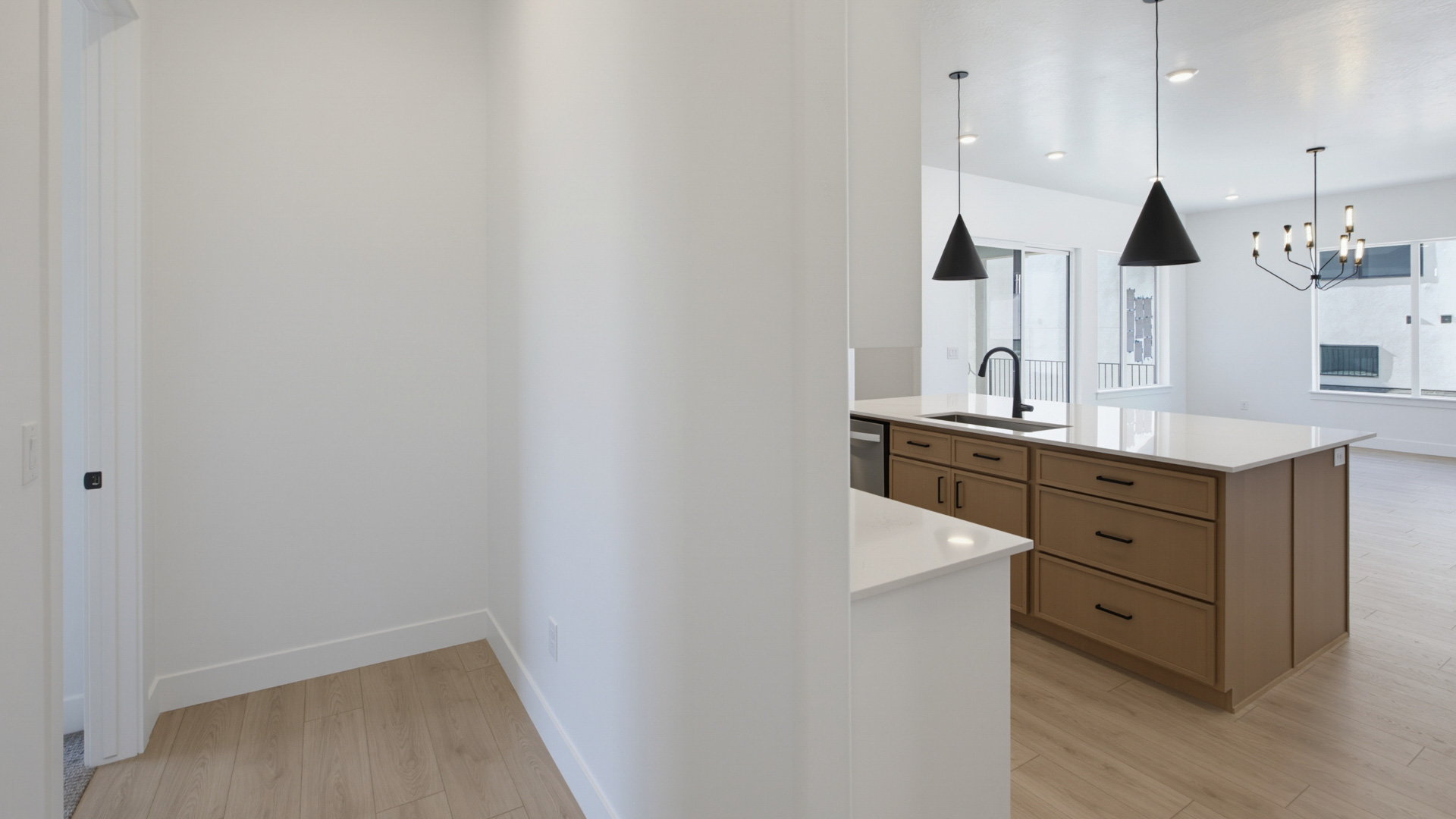 Kitchen with large kitchen island and stainless steel appliances.