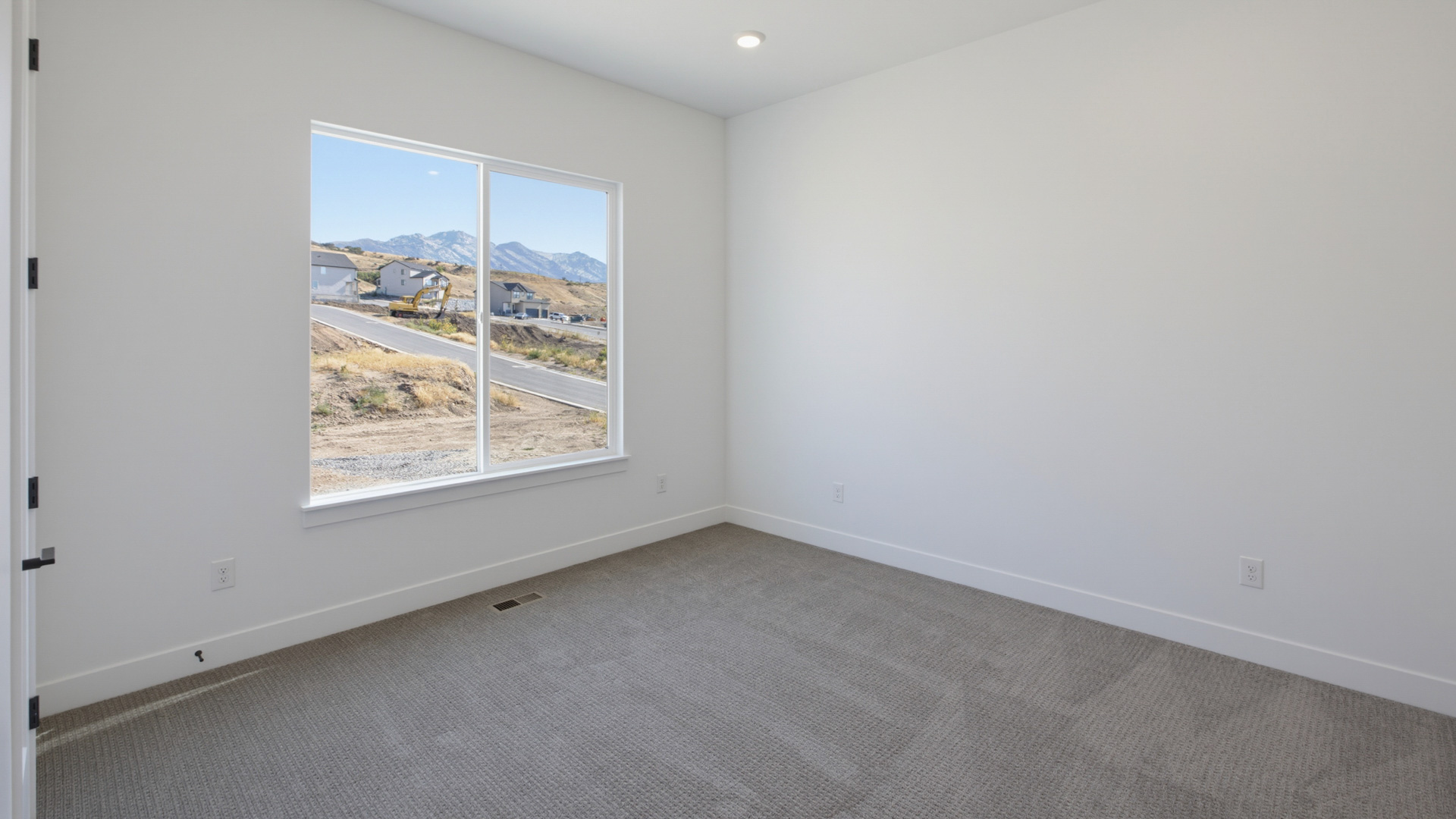 Bedroom with large window.