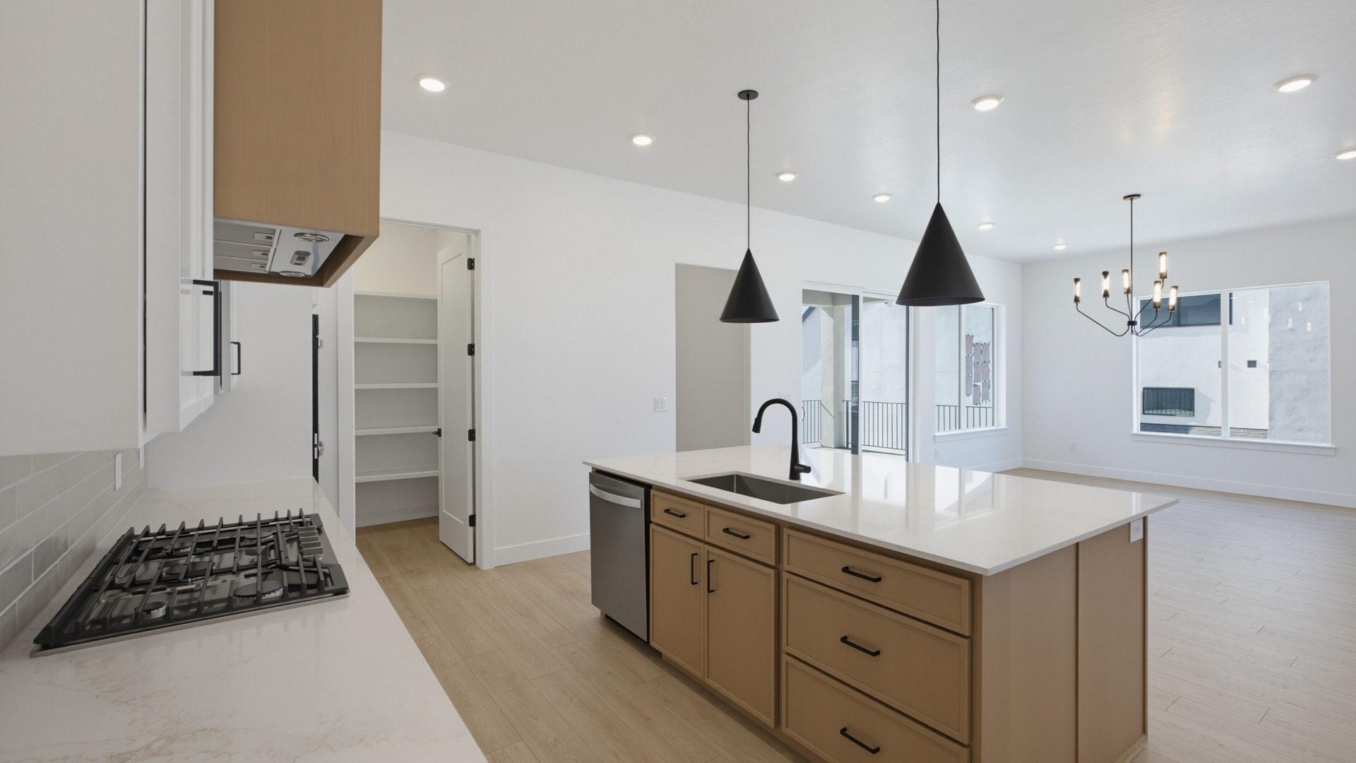 Kitchen with large kitchen island and stainless steel appliances.