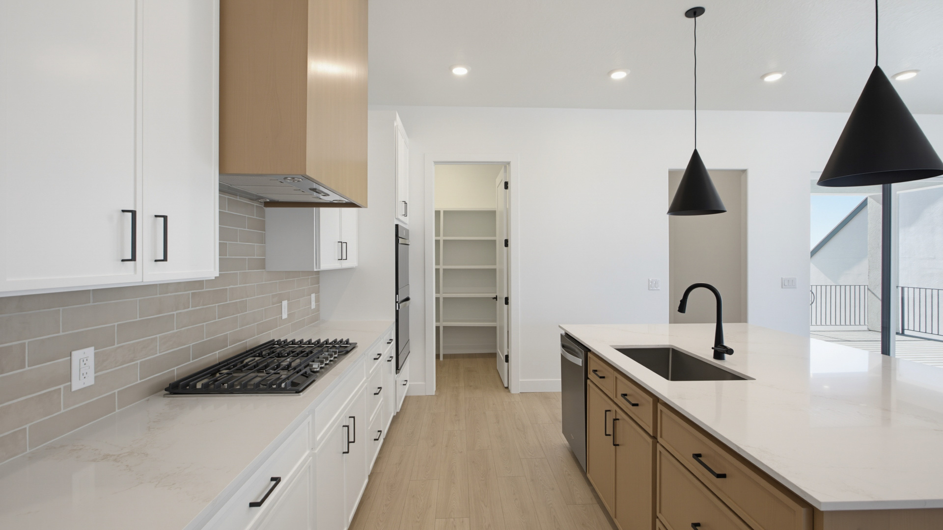 Kitchen with large kitchen island and stainless steel appliances.