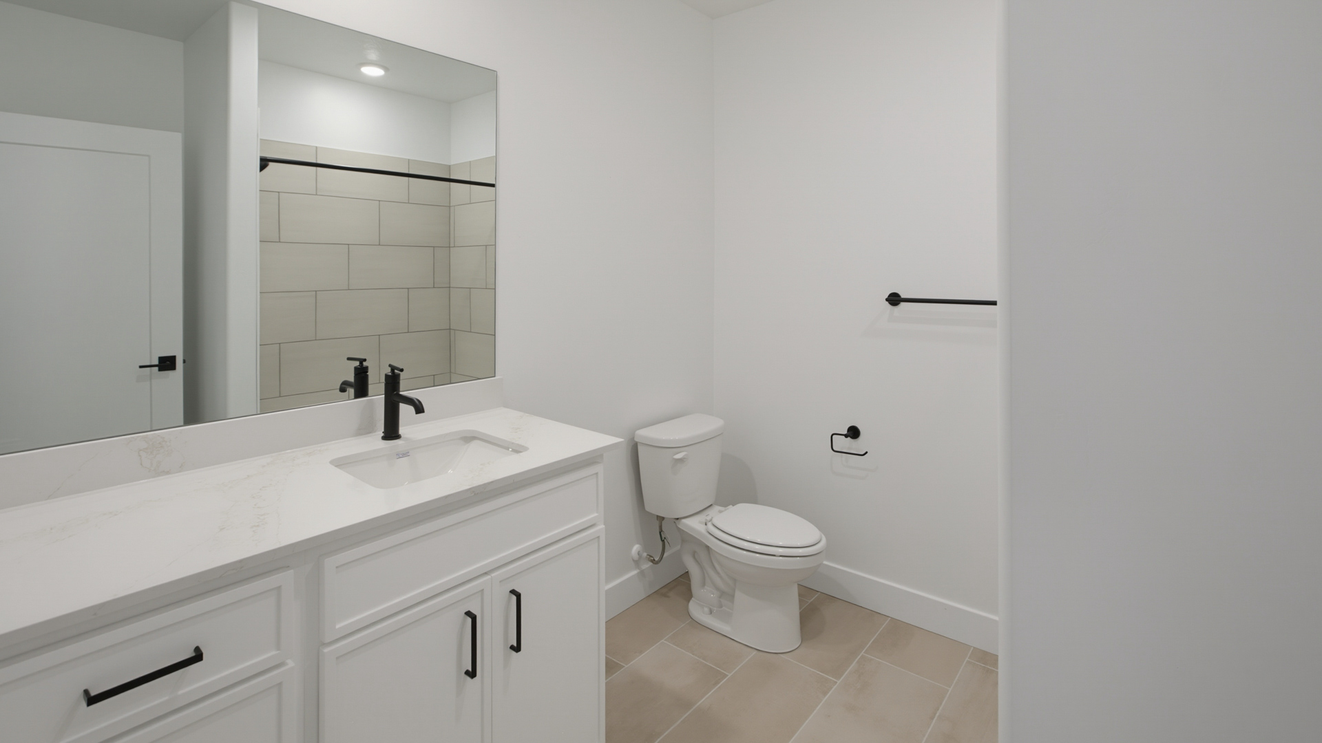 Basement bathroom with vanity.