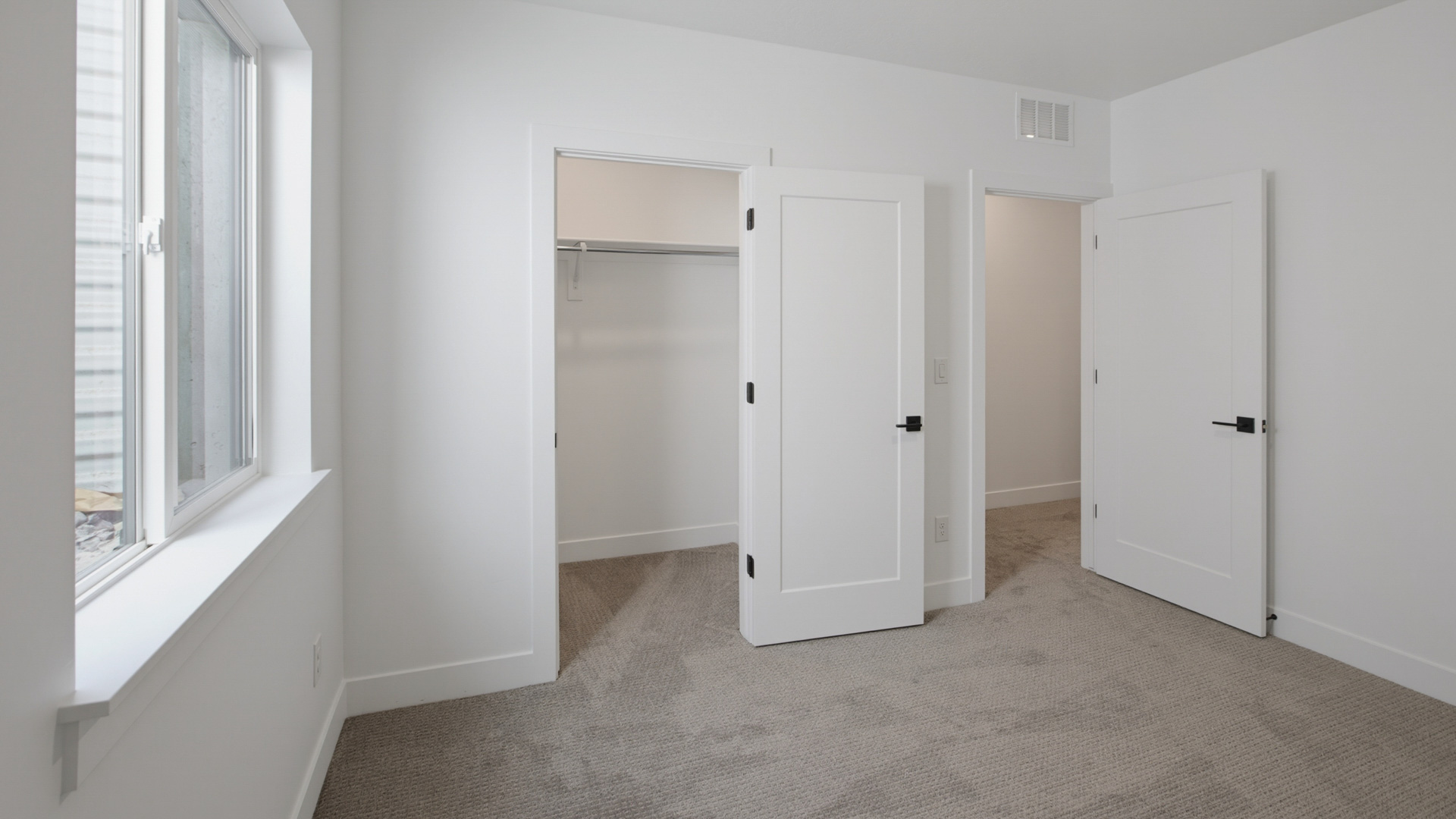 Bedroom with large window.