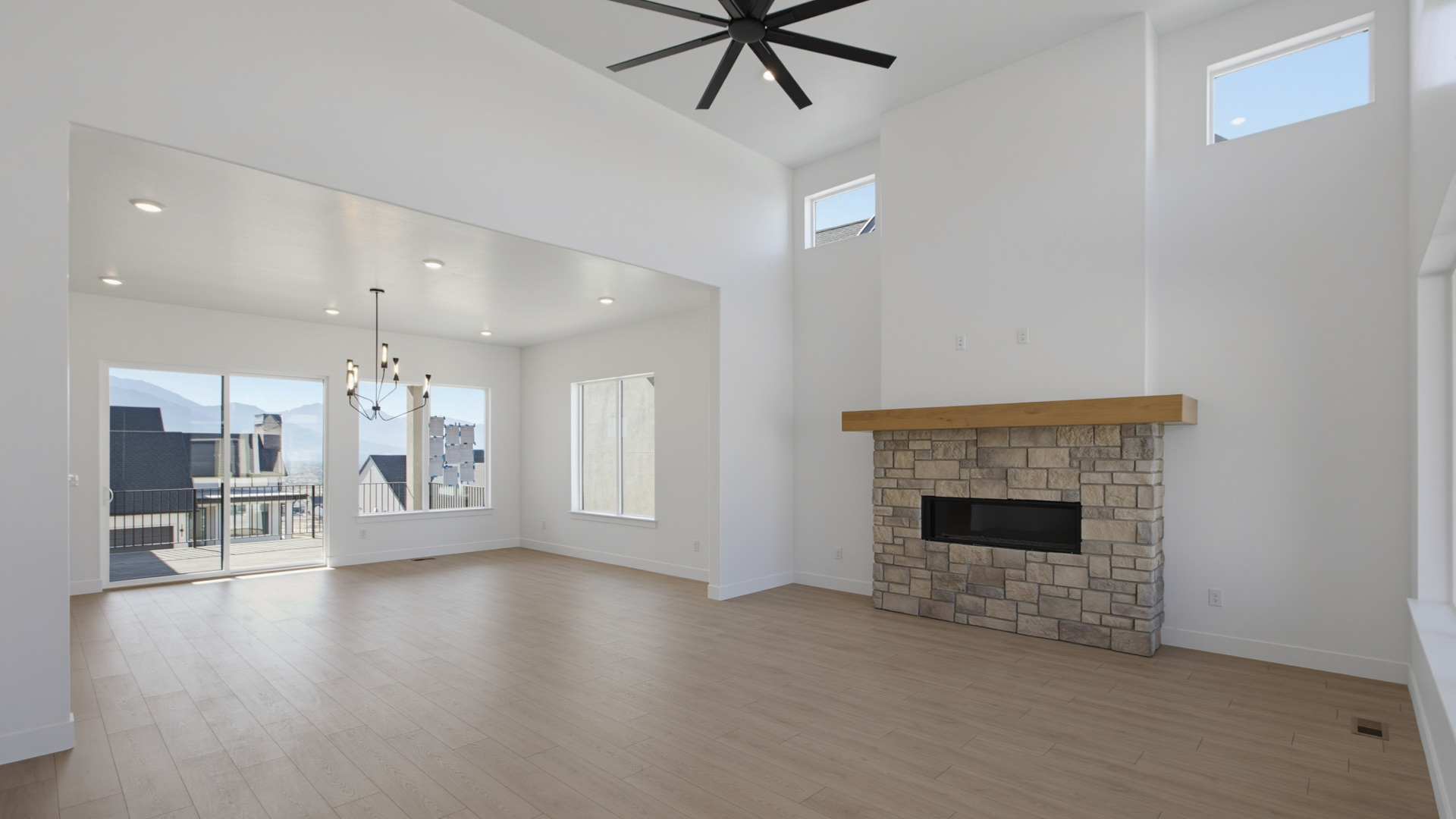 Family room with tall ceiling and fireplace.